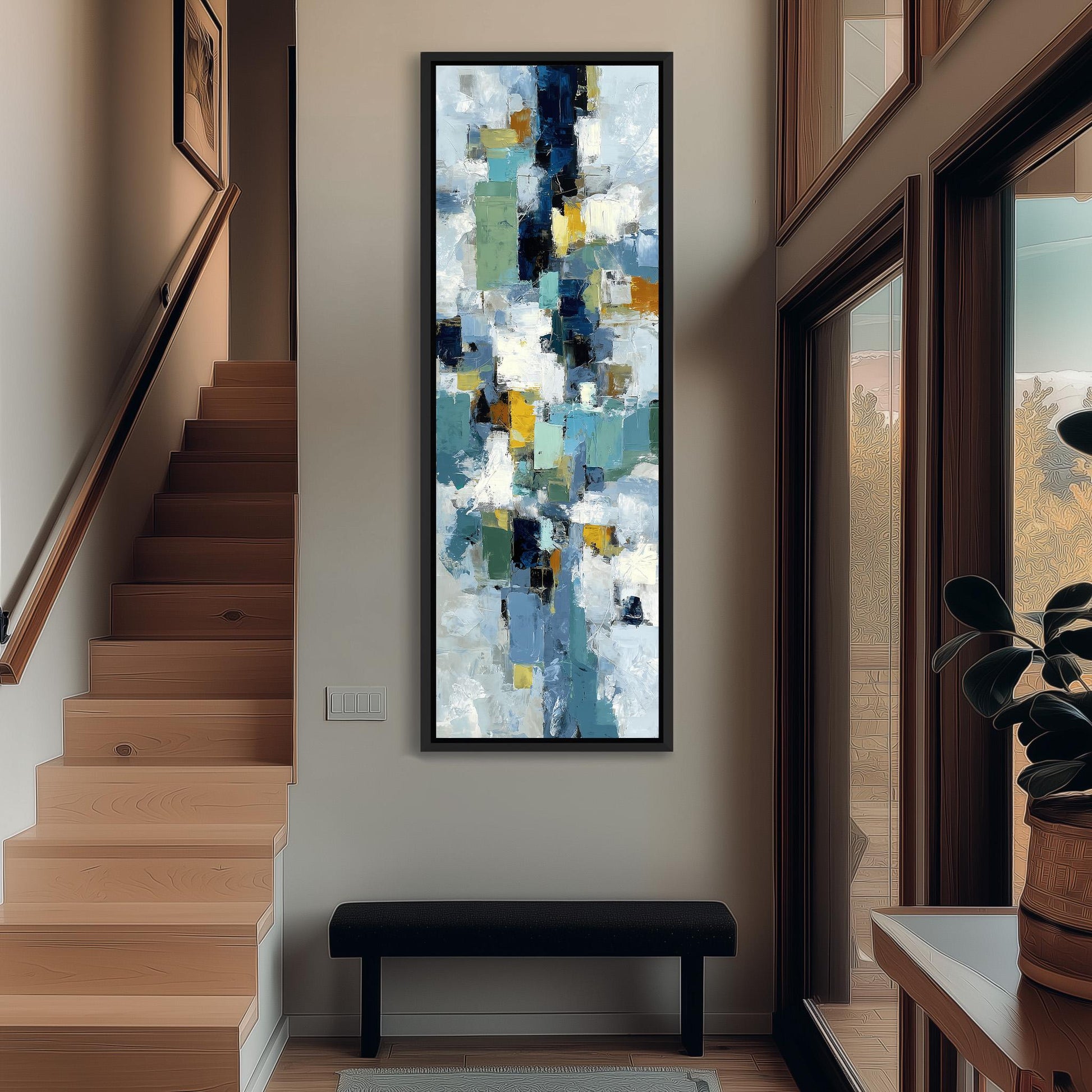 a modern art piece hanging on the wall of a hallway, with a wooden staircase and a bench in the foreground.