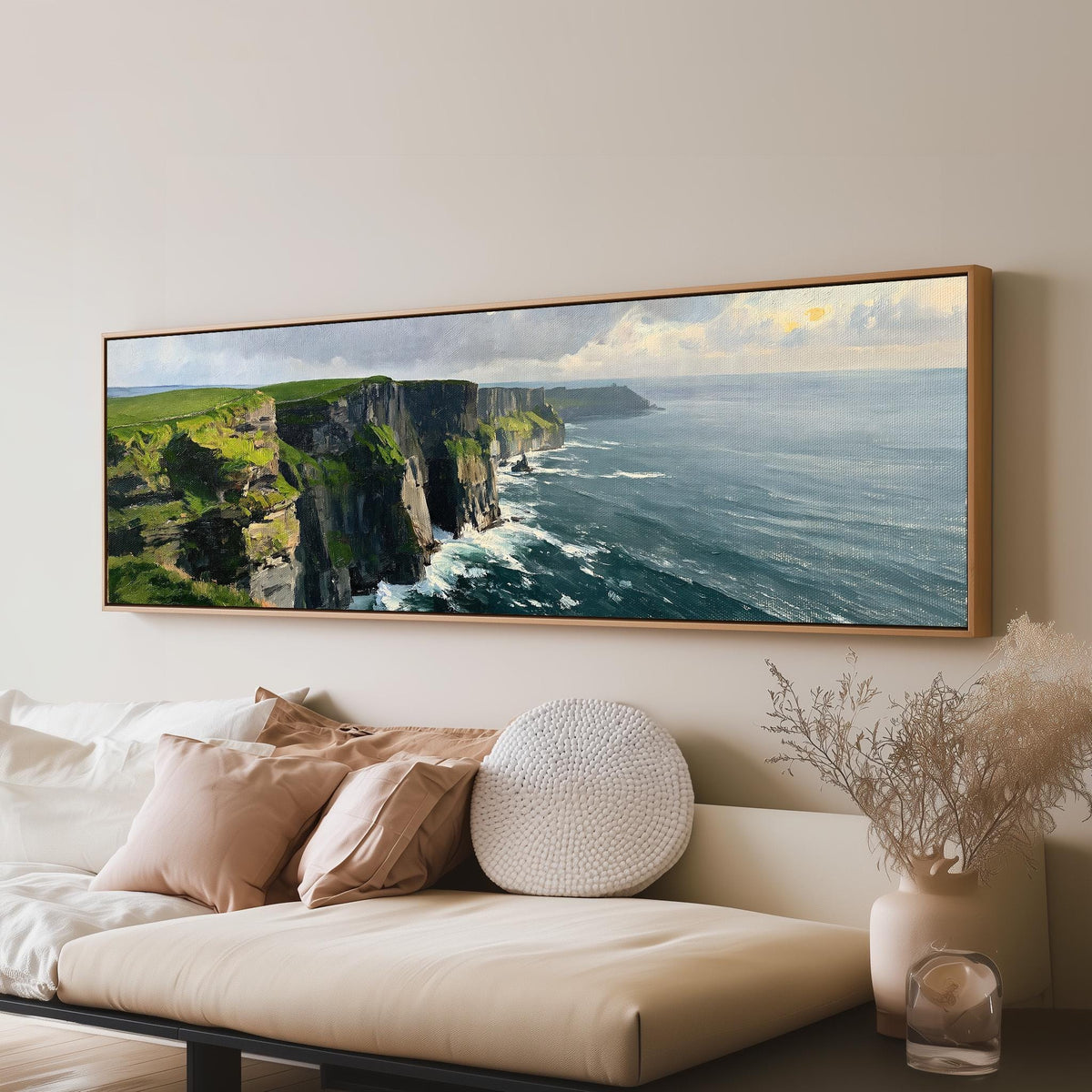 Emerald sea cliffs panoramic canvas print above a sofa in a living room