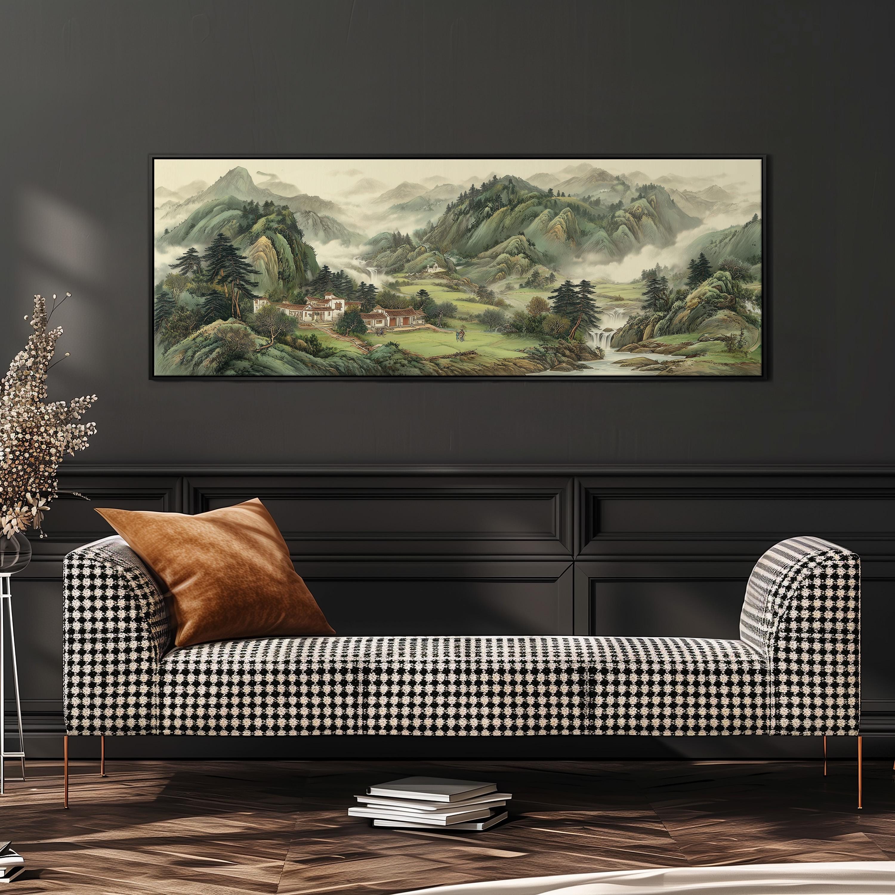 a large landscape painting hanging on a wall above a black and white checkered sofa with a brown throw pillow.