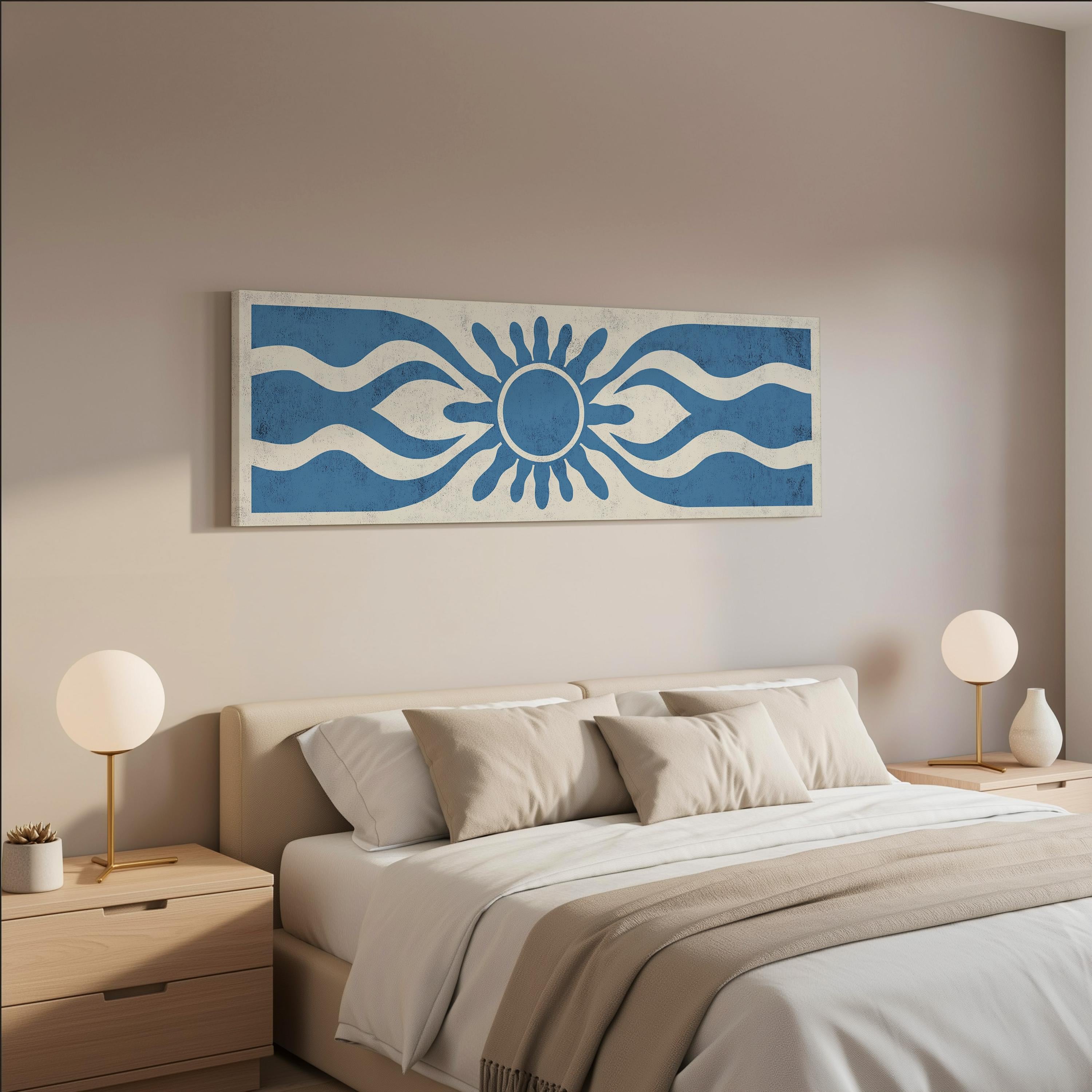 a serene and modern bedroom with a large bed adorned with white linens and beige pillows. Above the bed, there is a large blue and white abstract artwork featuring a sun-like design. The room is further decorated with two white lamps on nightstands, and the overall color scheme is predominantly neutral, with pops of blue and white adding visual interest.