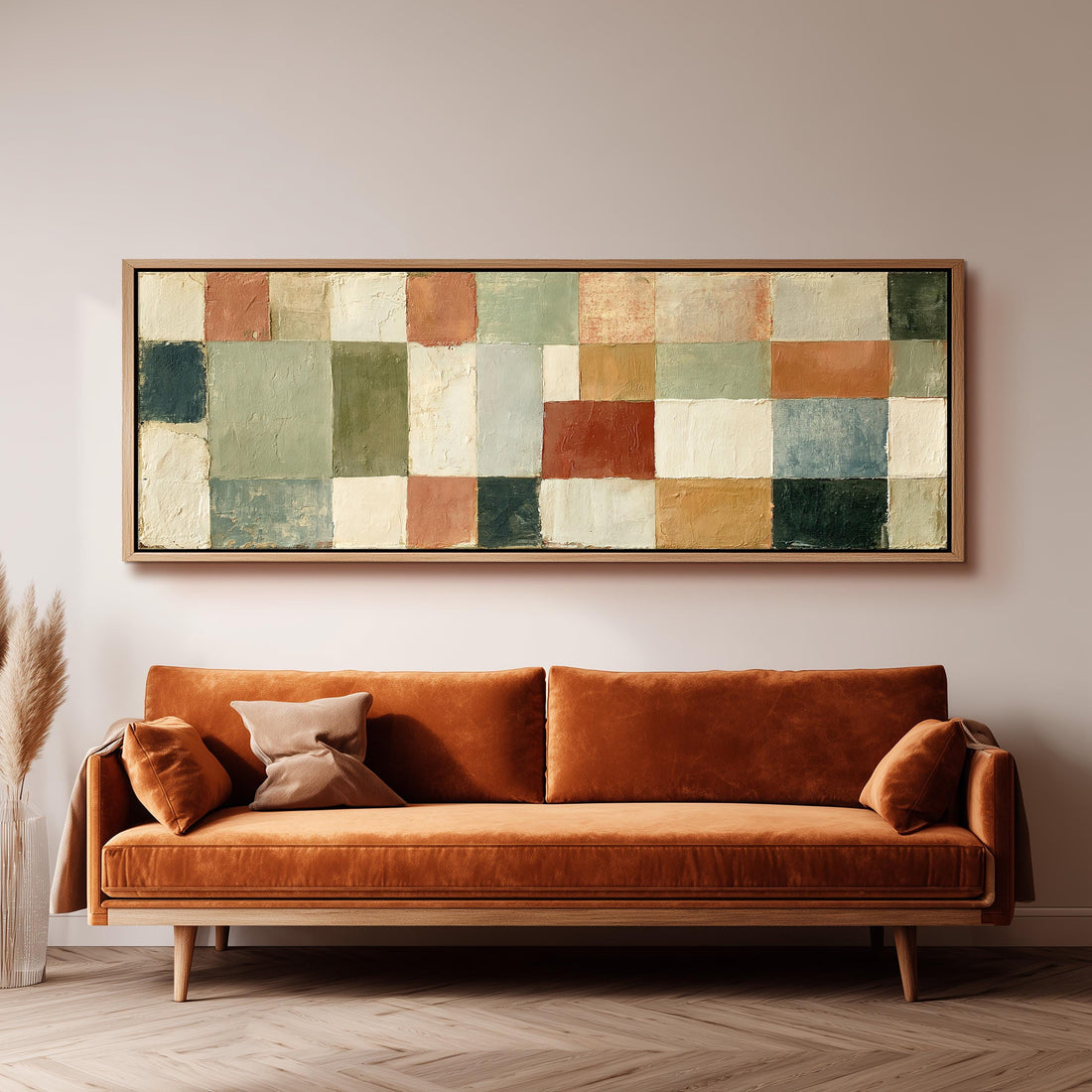Earth tone patchwork squares long horizontal canvas print above a sofa in a living room