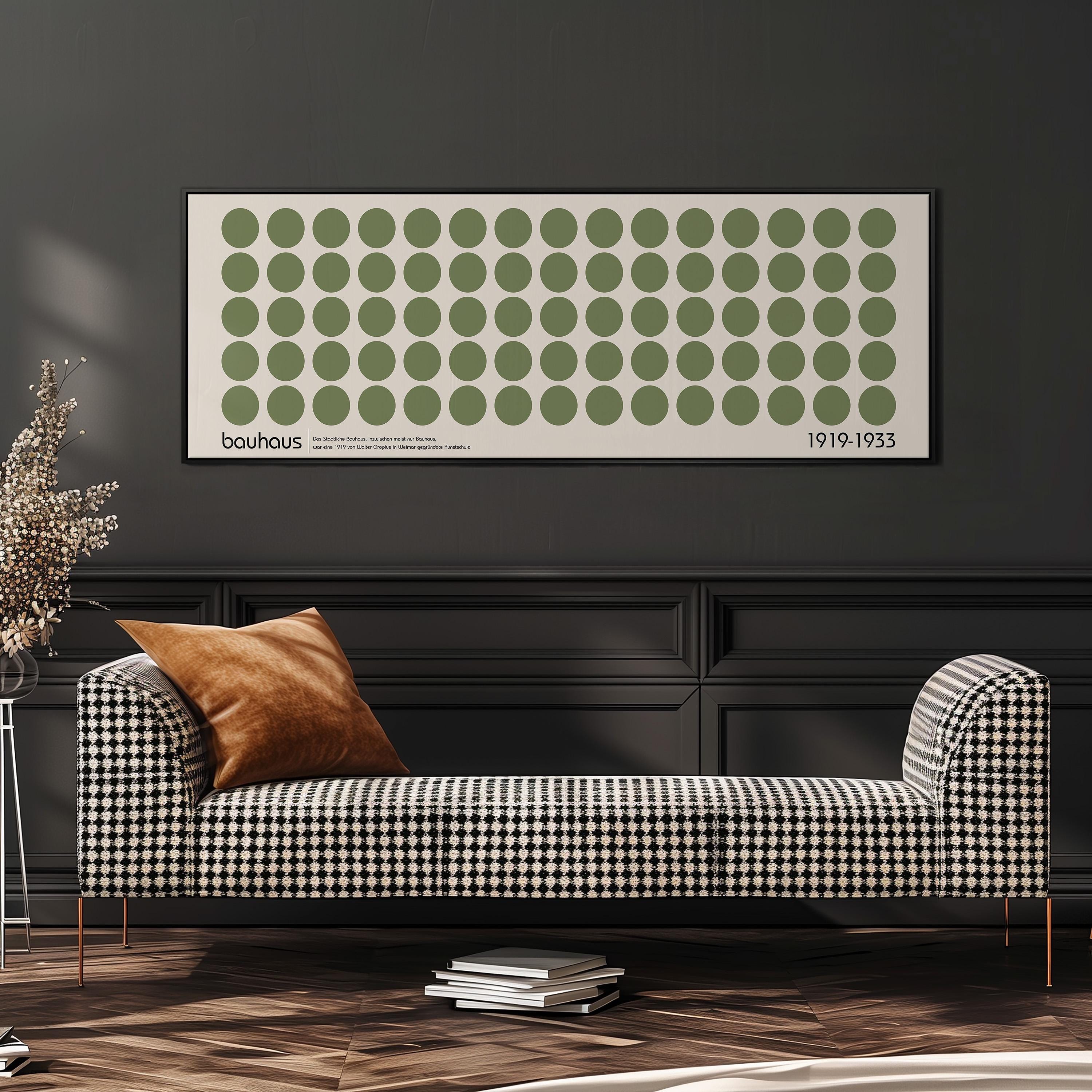 a modern living room with a black and white checkered sofa, a stack of books, and a large framed poster of a repeating pattern of green circles on a white background.