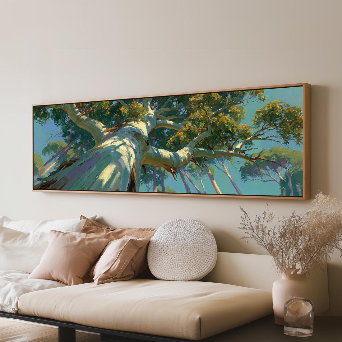 Eucalyptus canopy against a blue sky long horizontal canvas print above a sofa in a living room