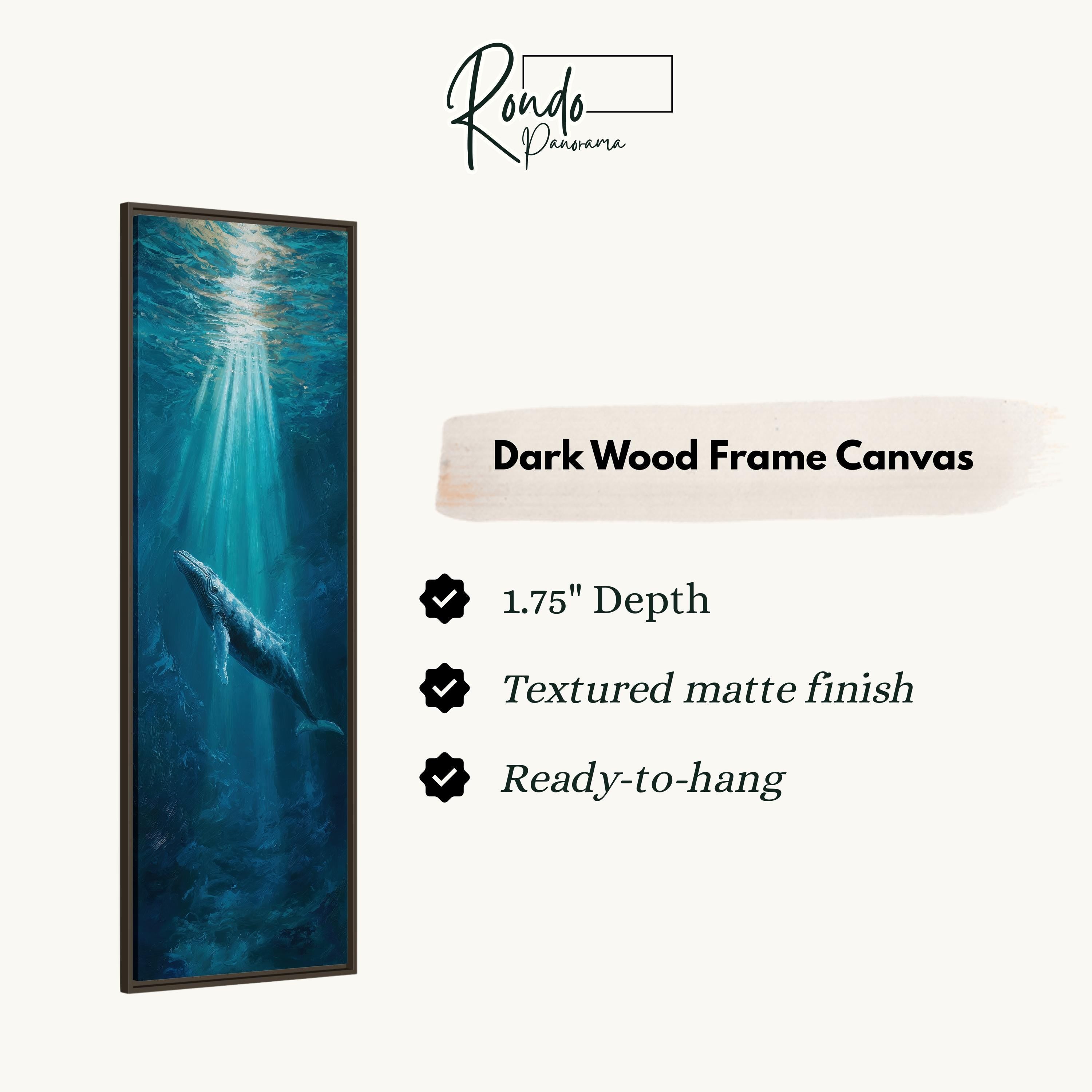 a painting of a whale swimming in the ocean, with a dark wood frame.
