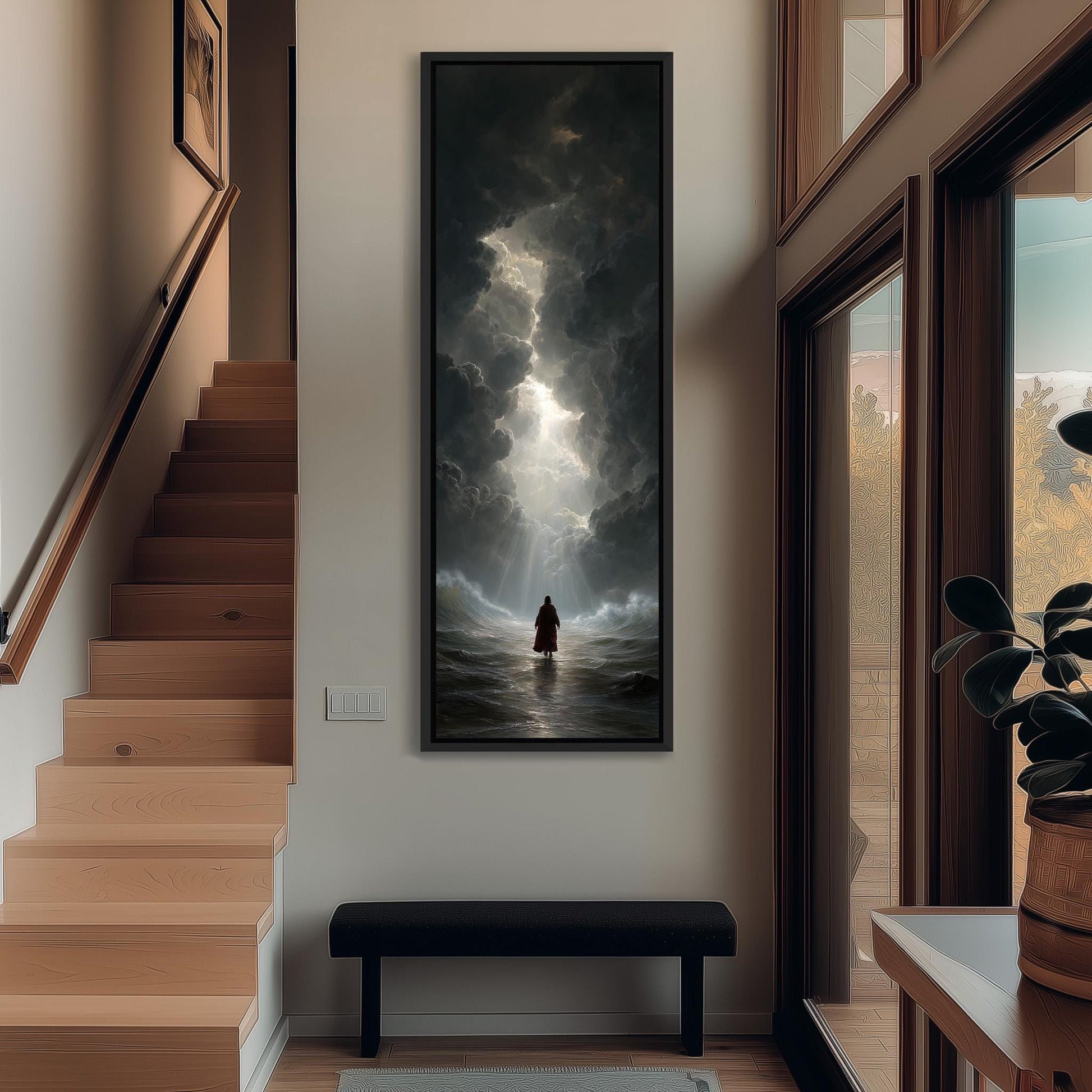 a person standing in a hallway with a large painting of a stormy sea hanging on the wall above a bench.