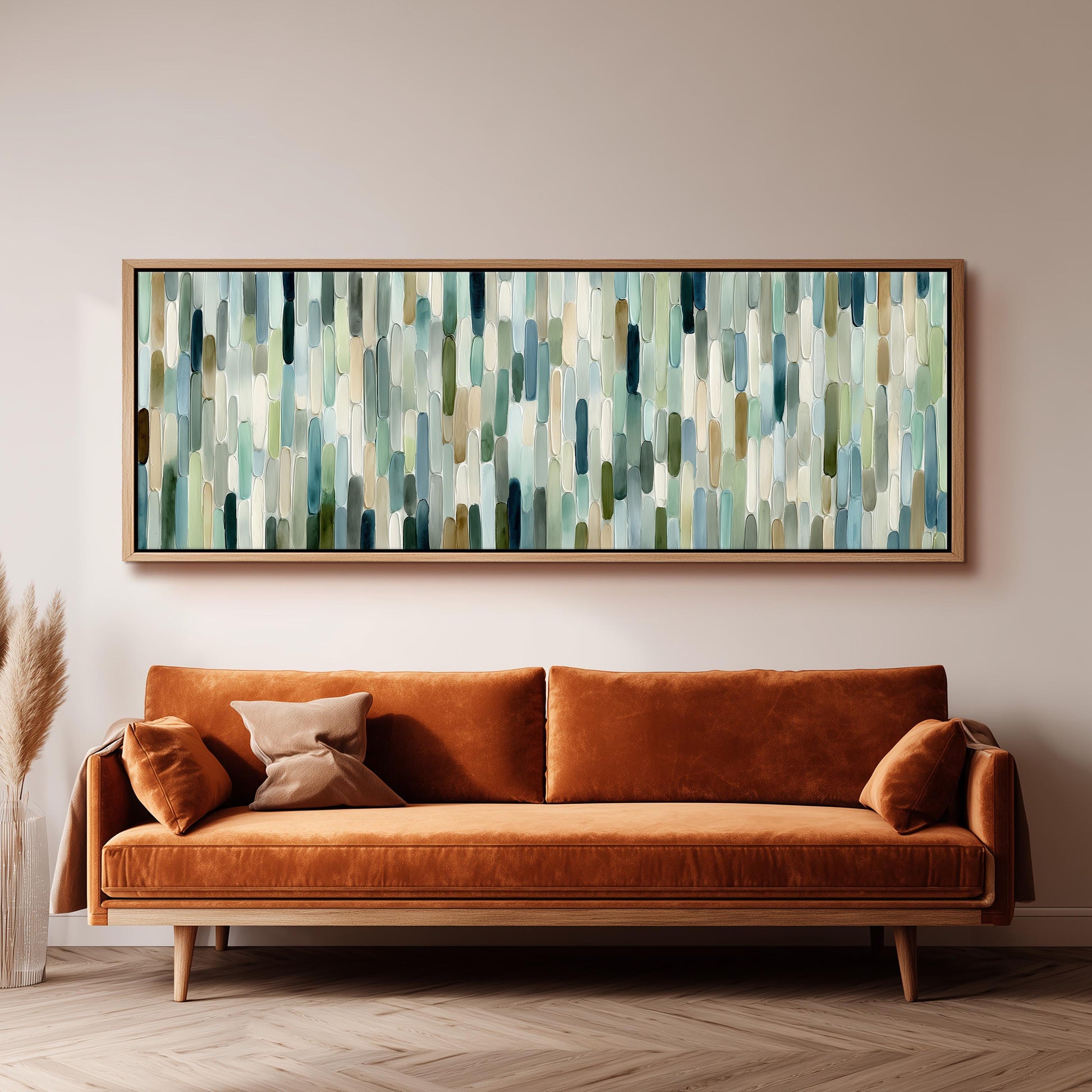 a large, rectangular abstract painting hanging on a wall above a brown sofa with orange cushions.