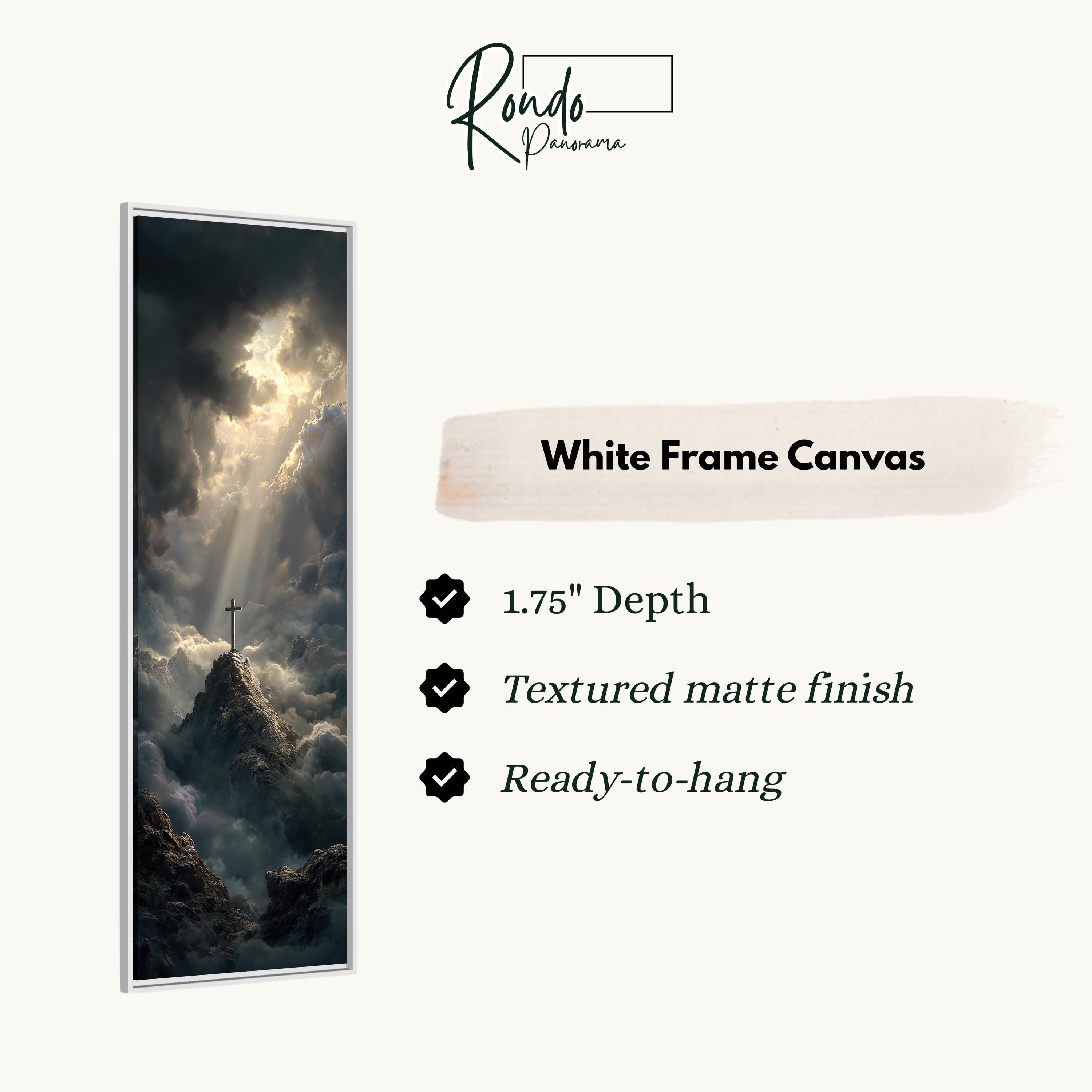 The image is a white frame canvas depicting a dramatic landscape with a cross on a mountain peak, surrounded by clouds and sunlight.