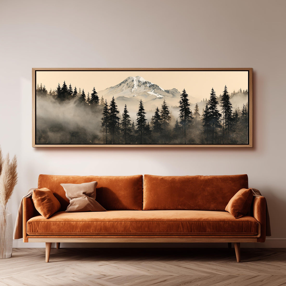 Foggy pine forest below a snowy mountain long horizontal canvas print above a sofa in a living room