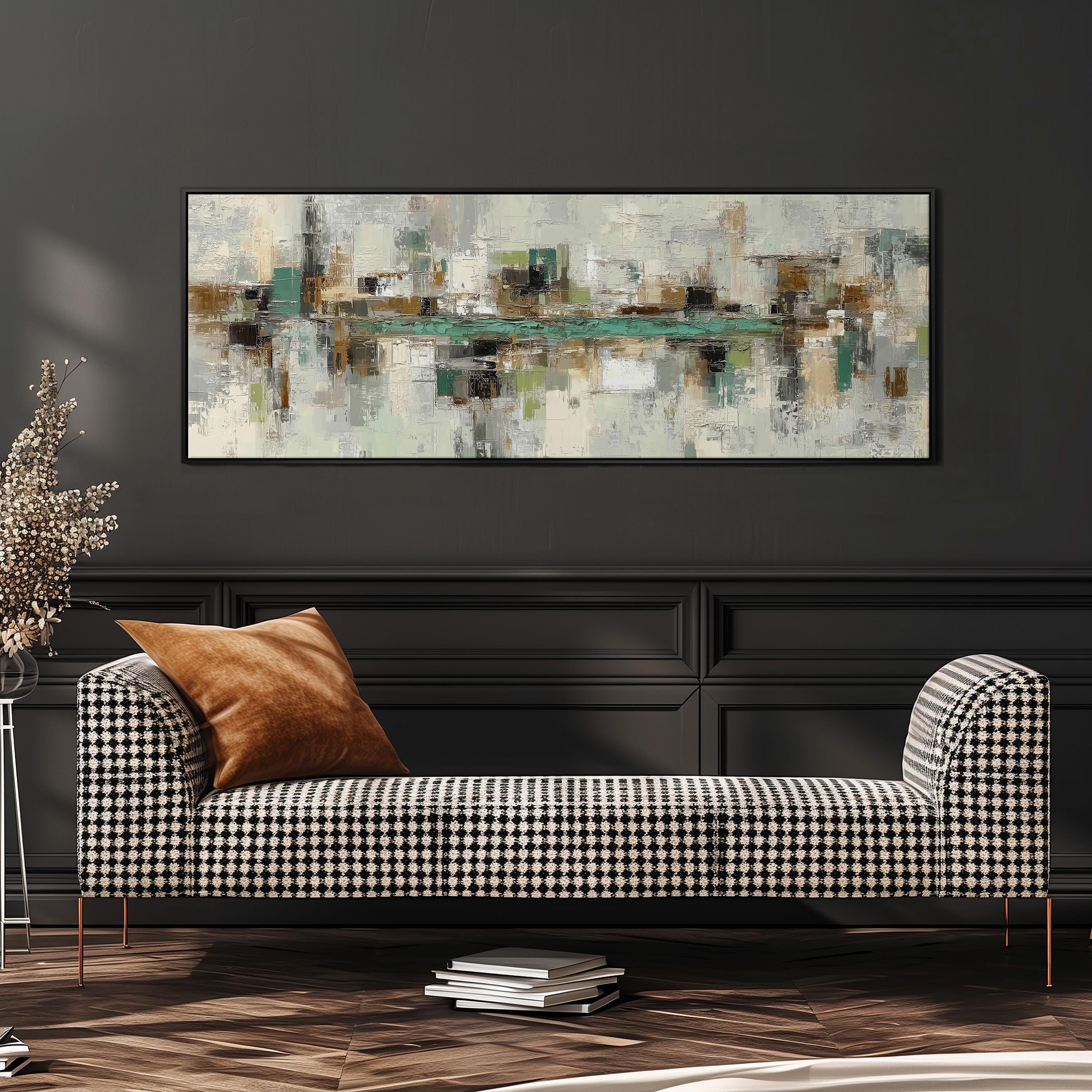 a modern living room with a black and white checkered sofa, a large abstract painting on the wall, and a stack of books on the floor.