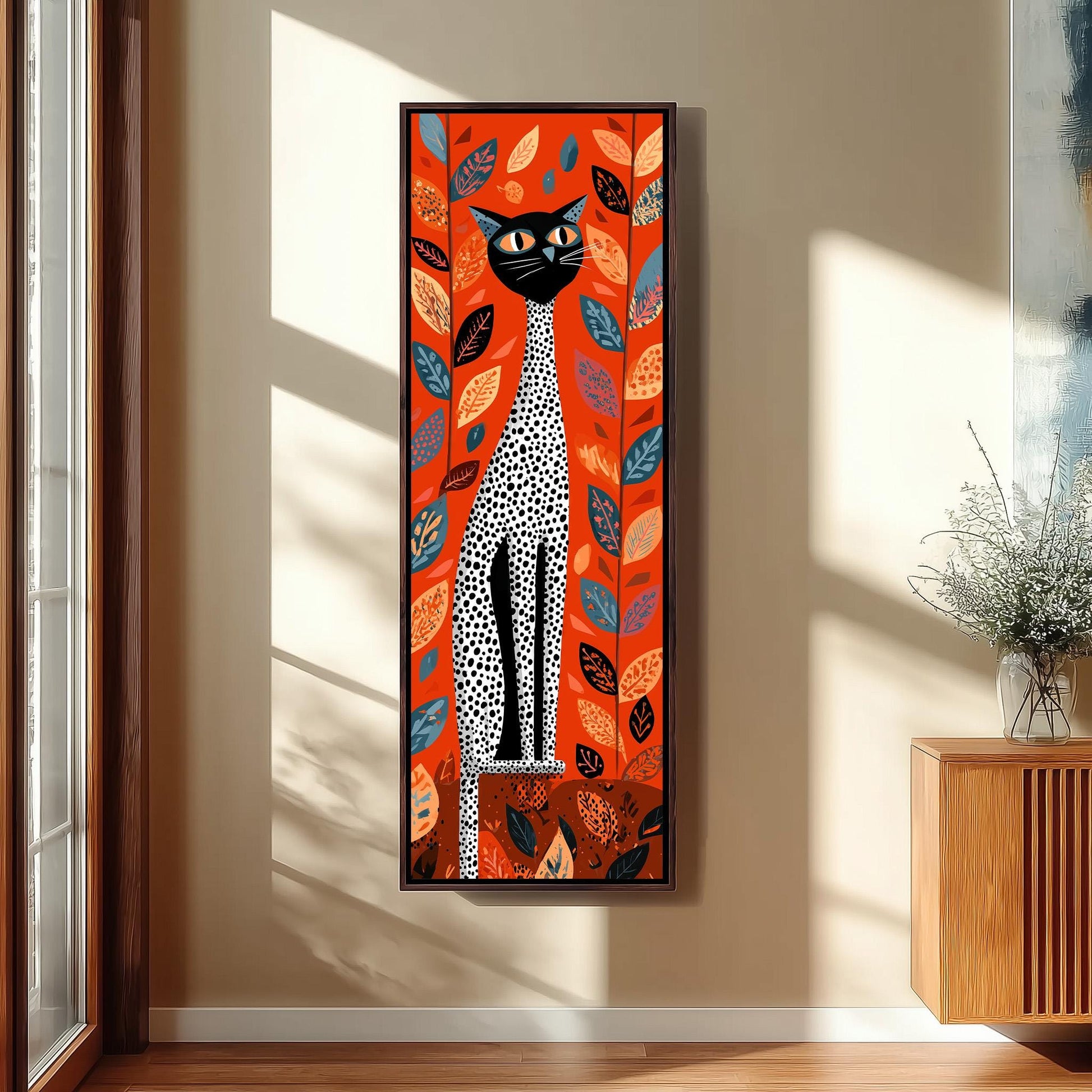 a large, colorful painting of a cat with a leopard-like pattern on its fur, set against a vibrant background of leaves and flowers. The painting is hanging on a wall in a room with a wooden cabinet and a vase of flowers nearby.