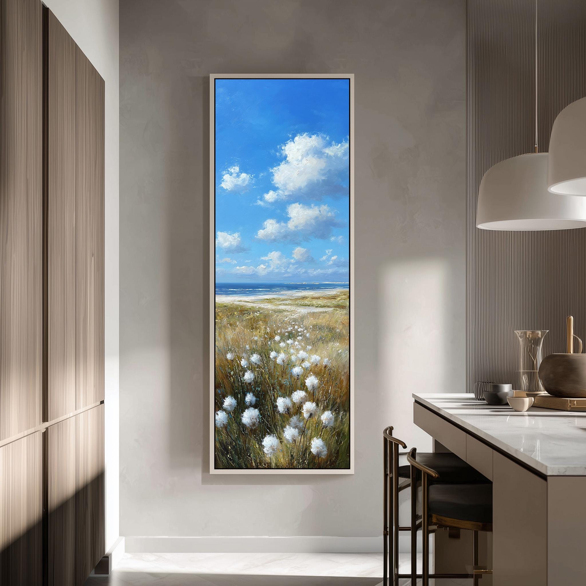 a large painting of a field with white flowers hanging on a wall in a modern kitchen.