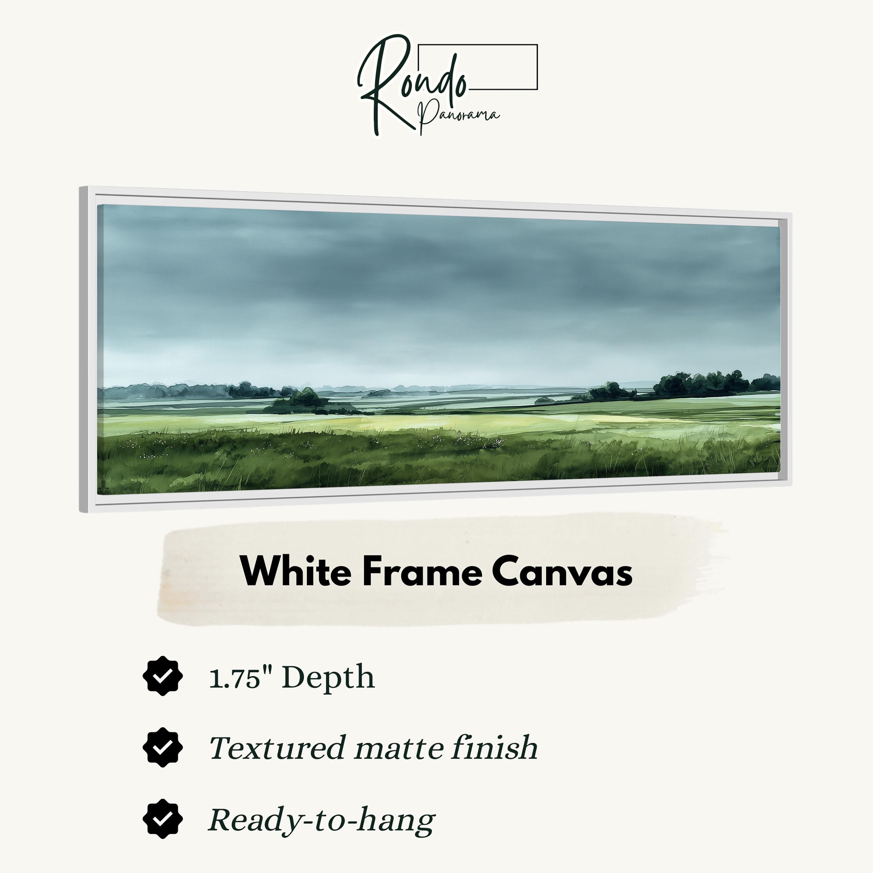 The image is a white frame canvas depicting a serene landscape with a field and trees under a cloudy sky.