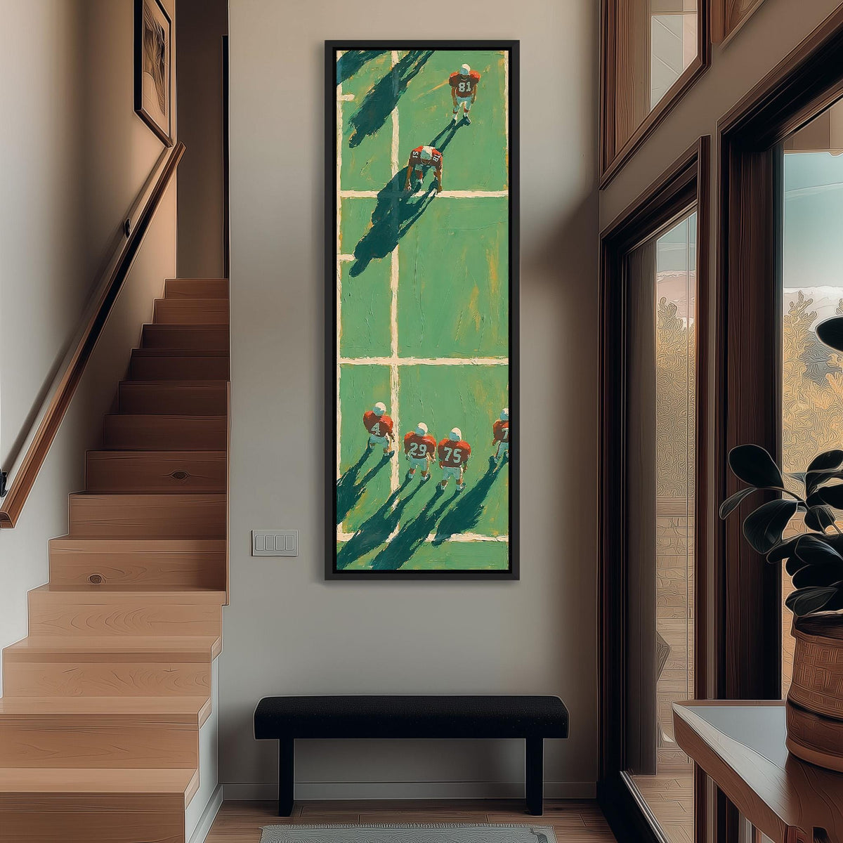 American football players on a field seen from above tall narrow canvas print beside a staircase in an entryway