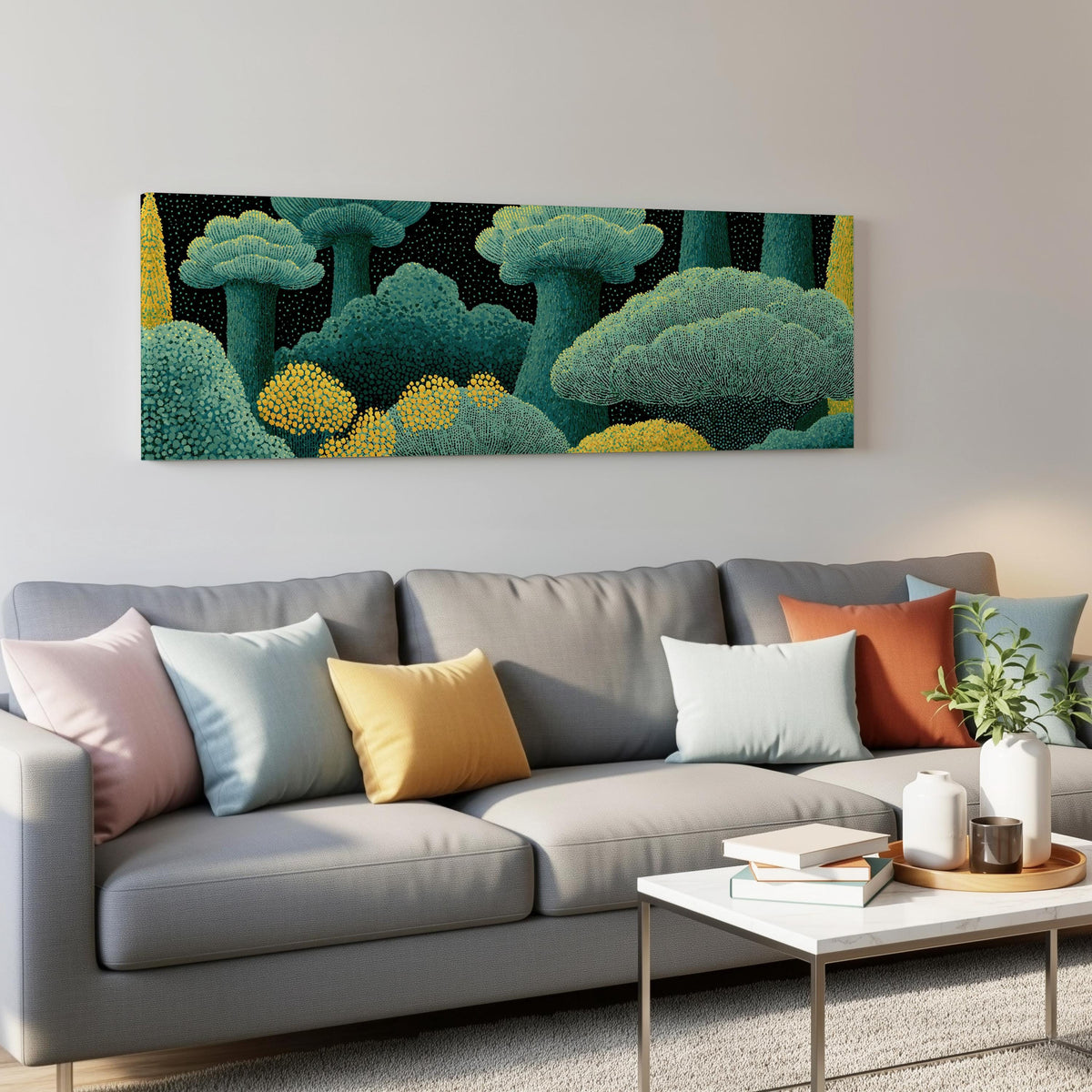 Teal dotted treetops panoramic canvas print above a grey sofa in a living room