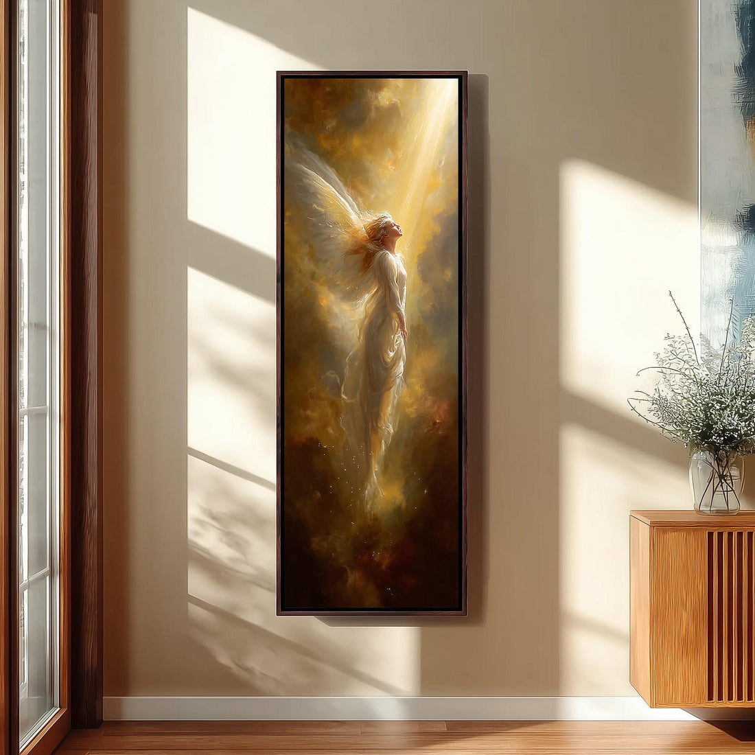 a large, framed painting of a woman with wings, standing in a room with sunlight streaming in from a window.