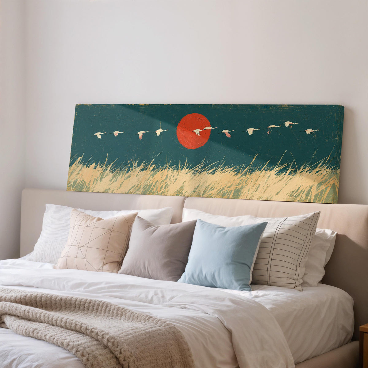 Bird flock over a prairie under a red sun wide panoramic canvas print above a bed in a bedroom