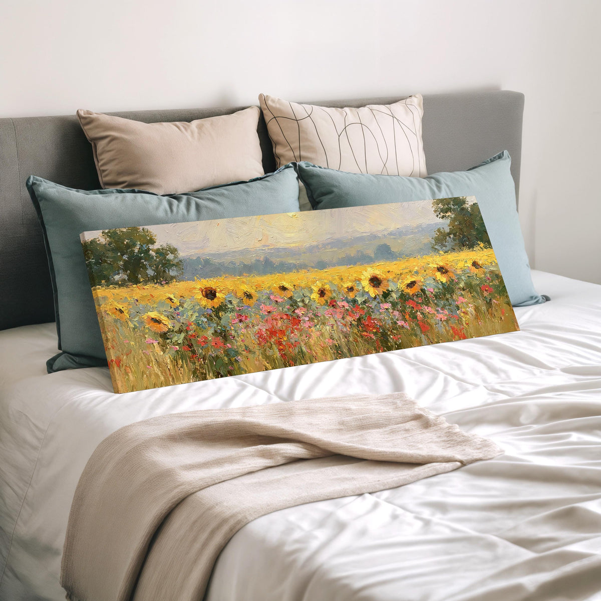 Sunflower and poppy meadow wide panoramic canvas print laid on a bed to show its size