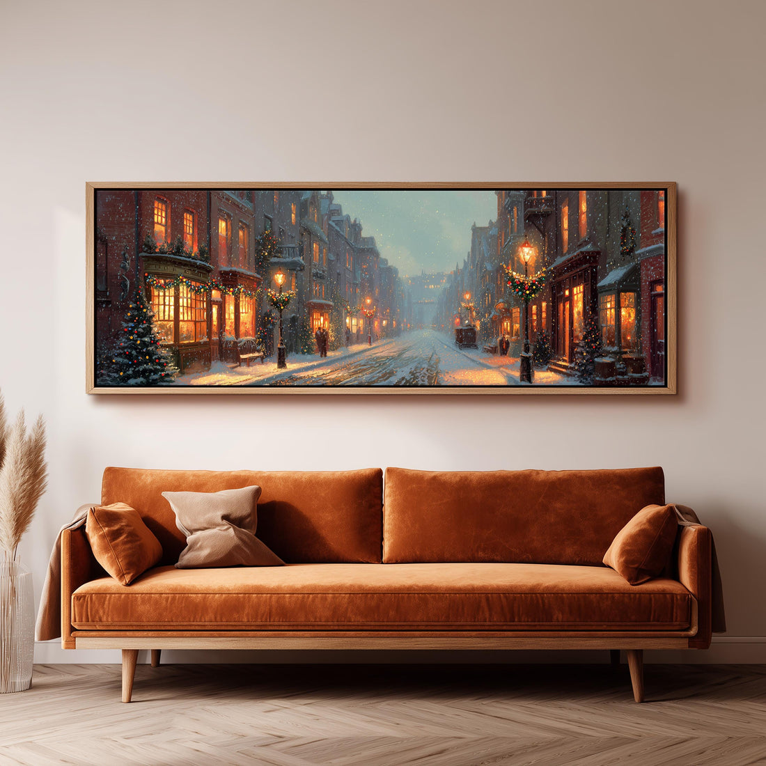 a large, framed painting of a snowy city street at night, with buildings and streetlights illuminated.