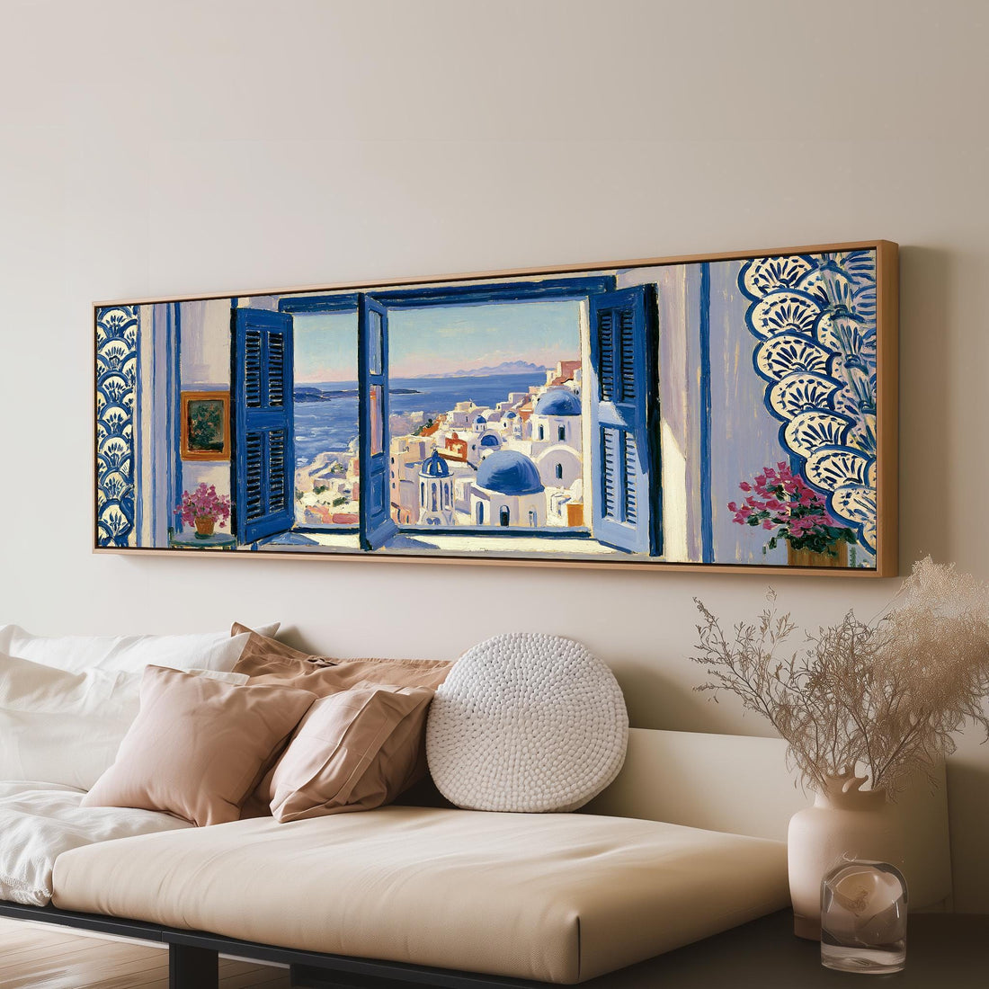 Santorini blue domes seen through a window long horizontal canvas print above a sofa in a living room