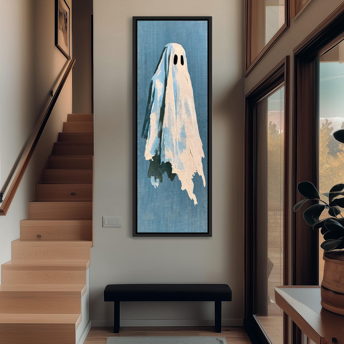 Folk art ghost on blue tall narrow canvas print beside a staircase in an entryway