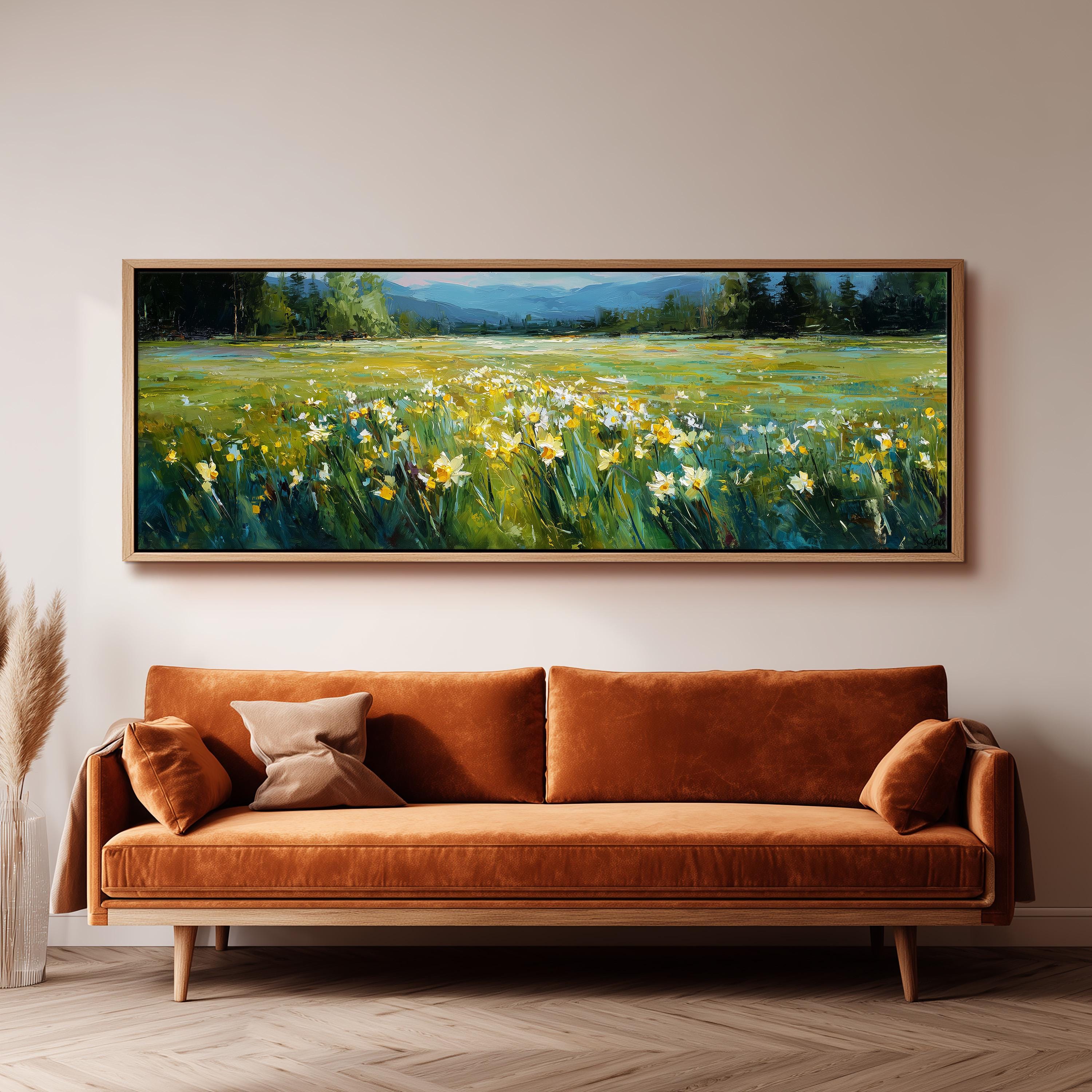 a large painting of a field with yellow flowers hanging on a wall above a brown sofa.