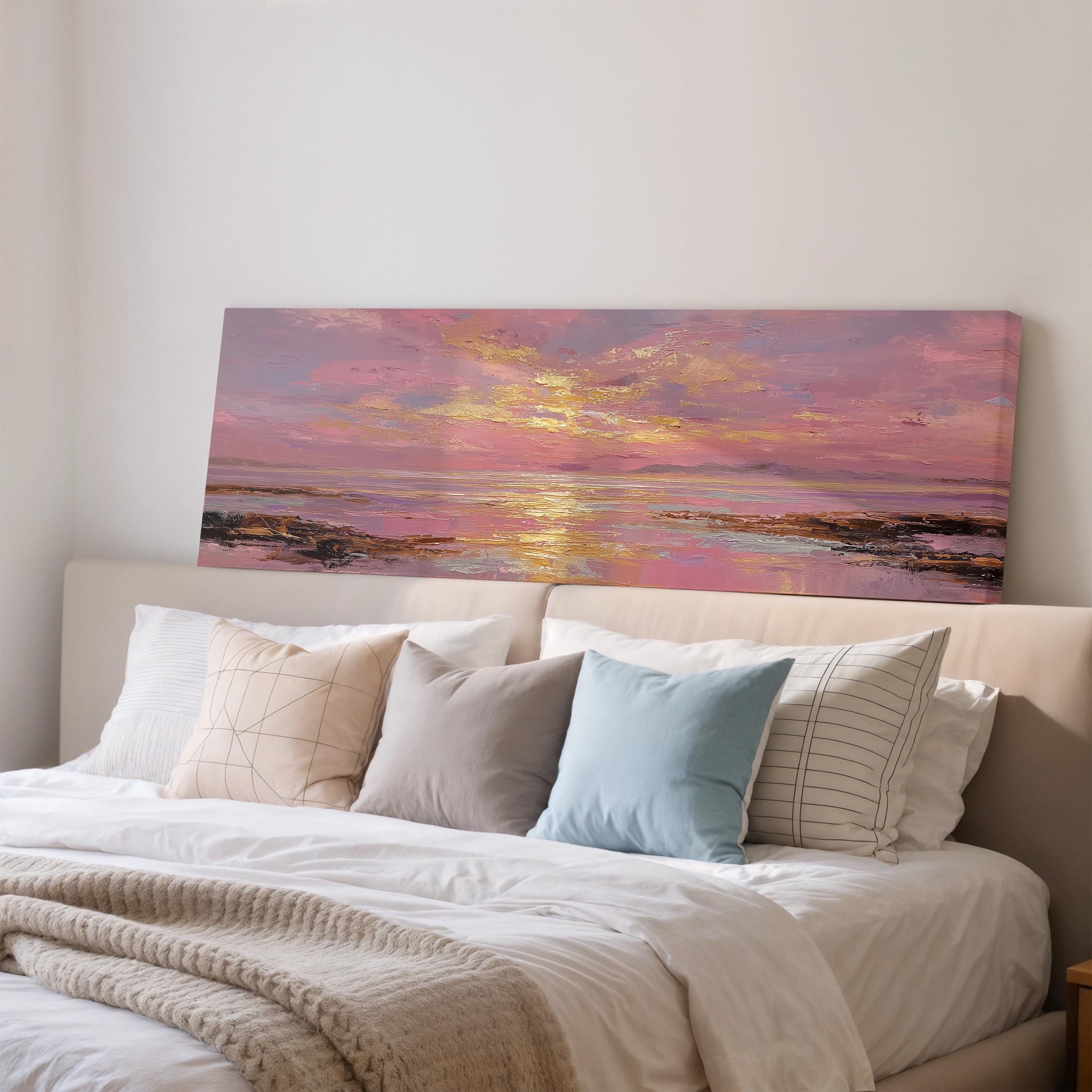 a large, colorful painting of a sunset over a body of water, which is displayed on the wall above a bed with white bedding and pillows.