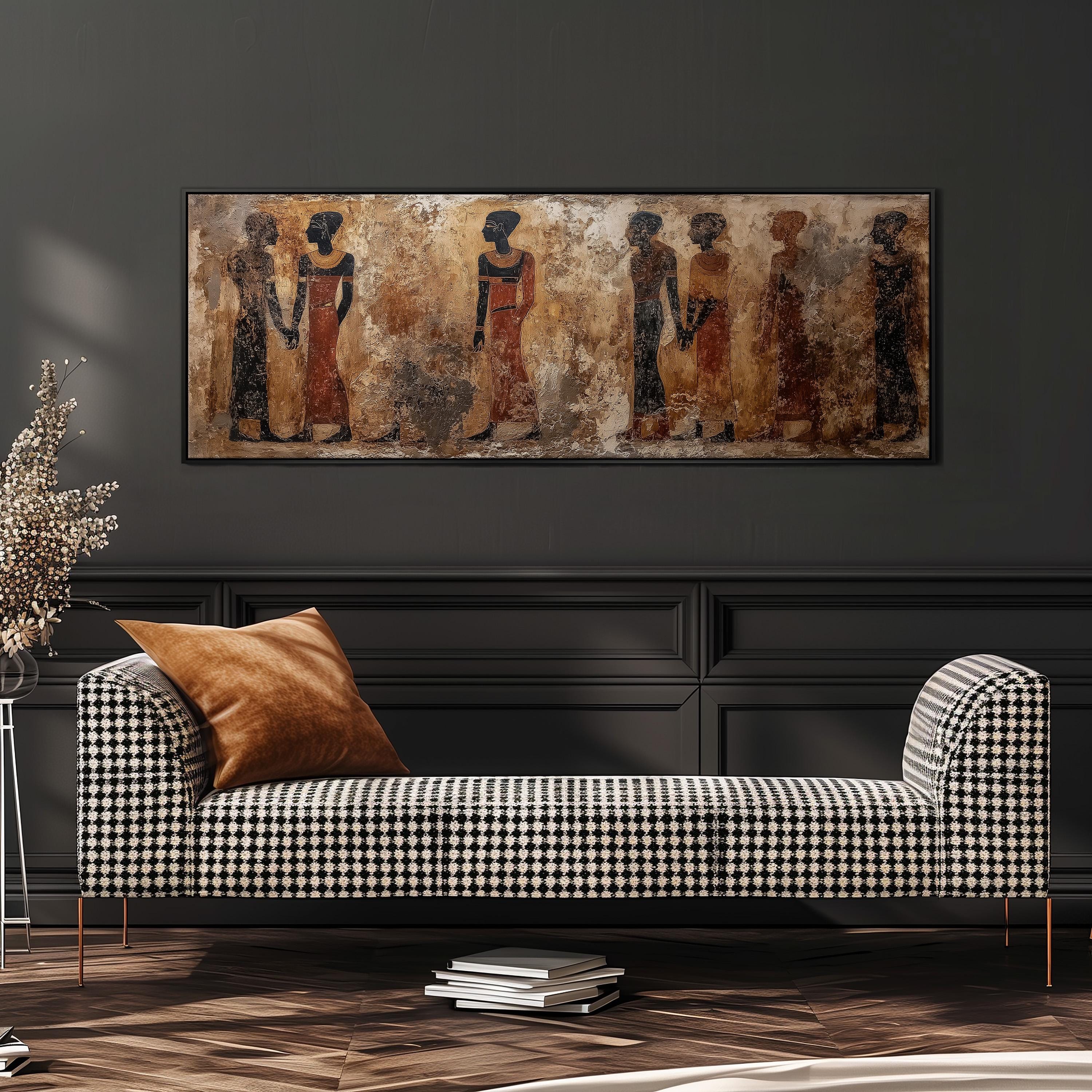 a modern living room with a black and white checkered sofa, a large framed painting of ancient Egyptian figures above it, and a stack of books on the floor.