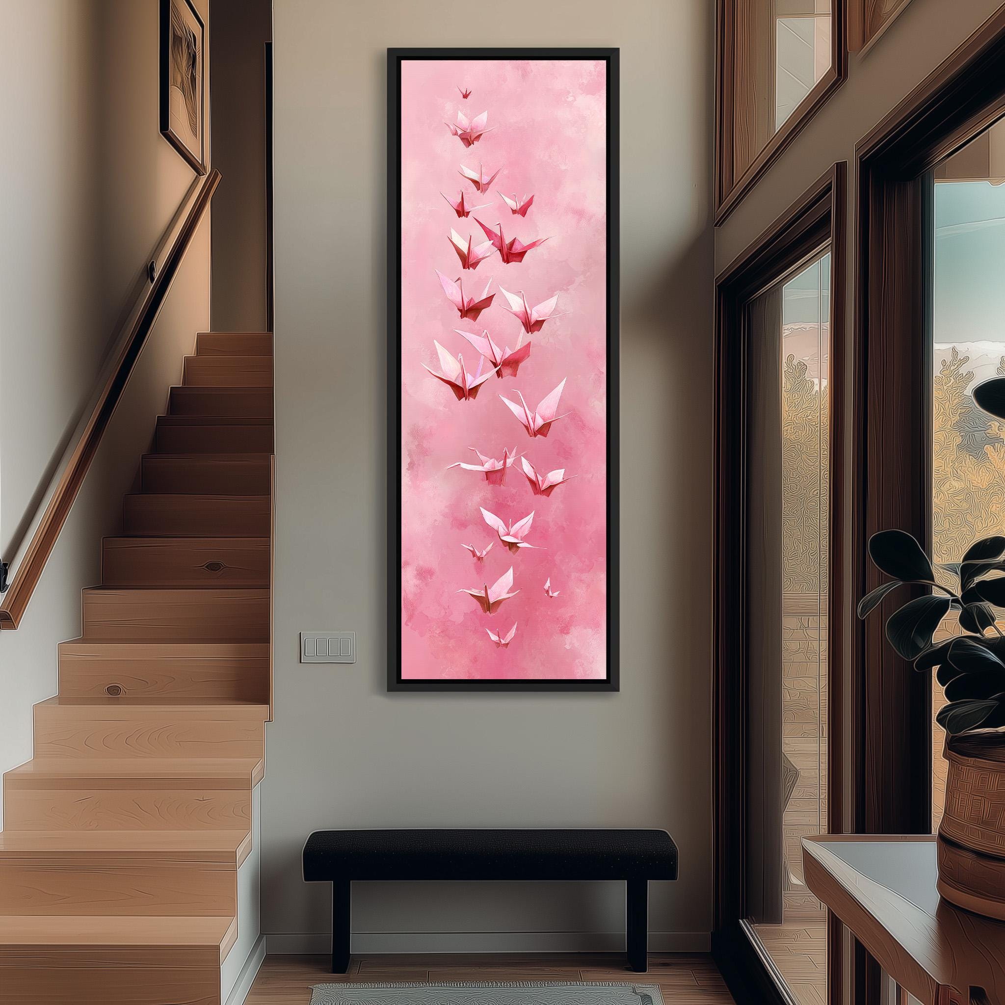 a large, vibrant pink painting of pink origami birds hanging on the wall of a hallway.