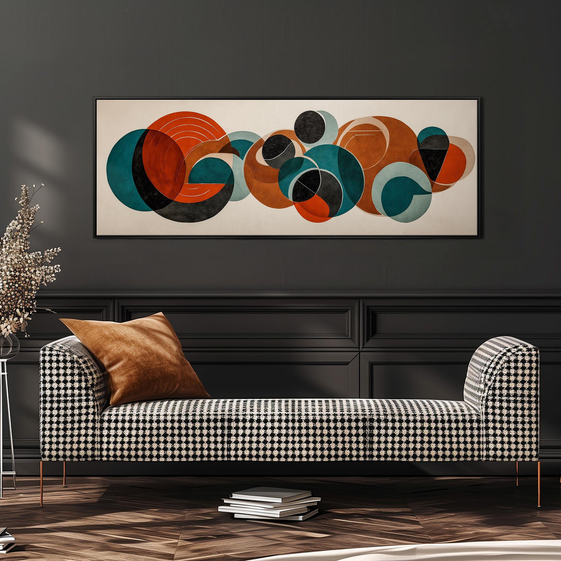 a modern living room with a black and white checkered sofa, a stack of books, and a large abstract painting hanging on the wall above the sofa.