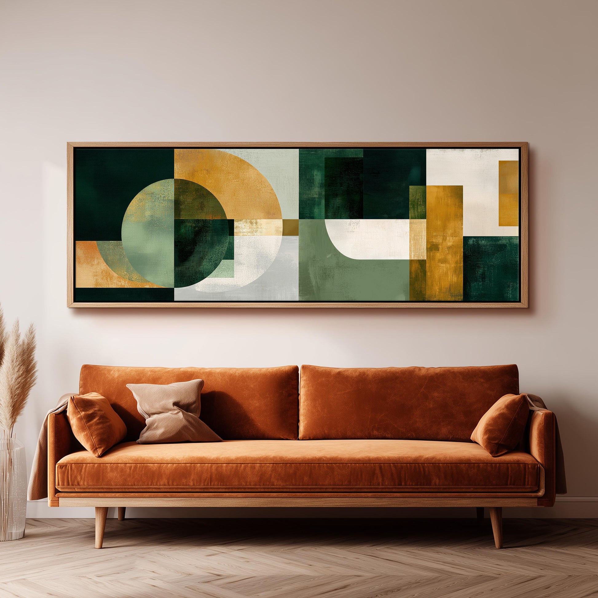 a large abstract painting hanging on a wall above a brown sofa with a wooden frame.