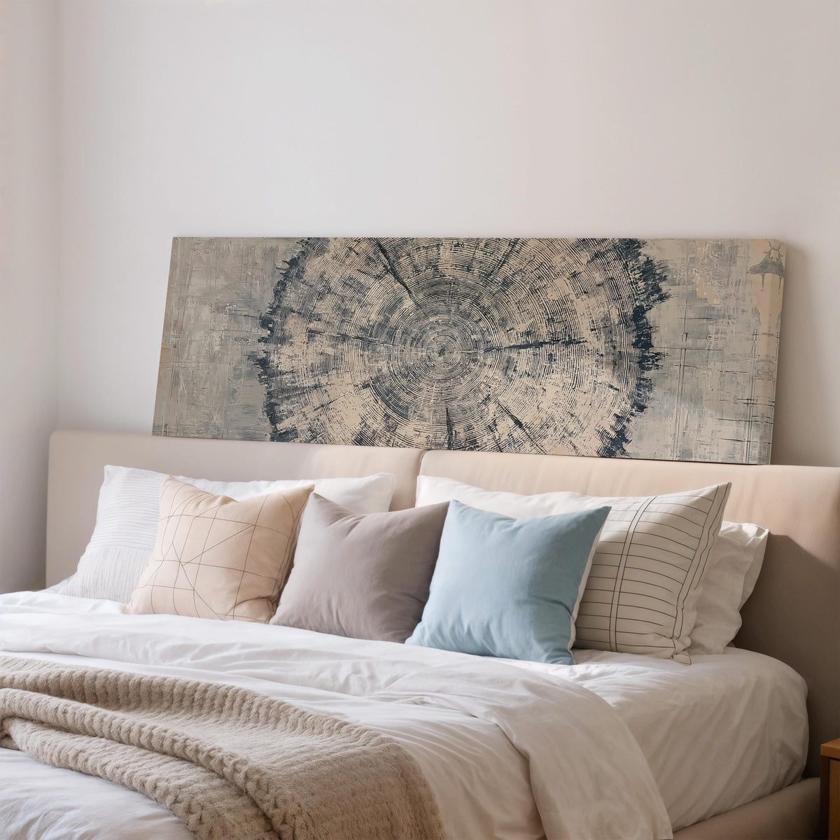 Navy ink tree ring wide panoramic canvas print above a bed in a bedroom