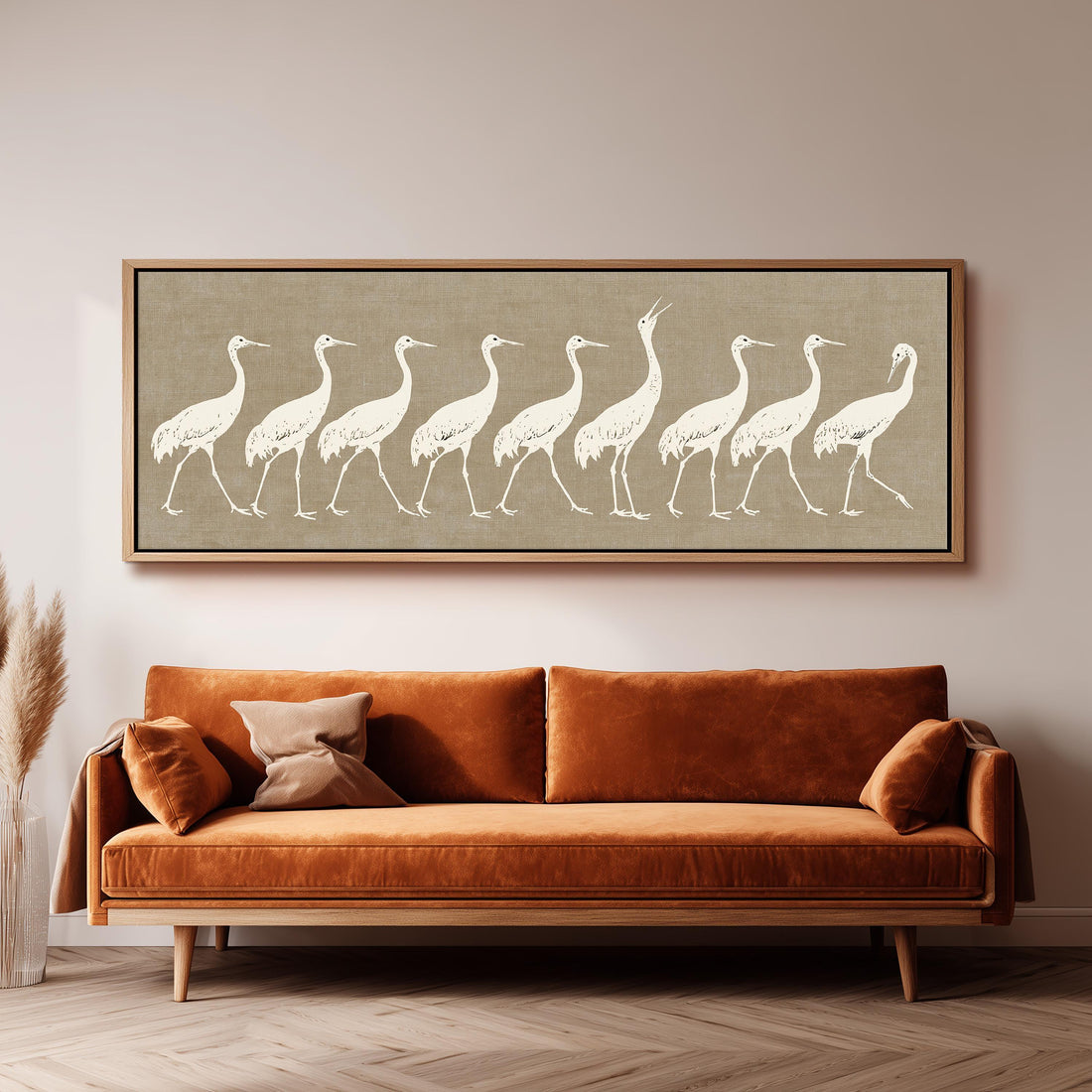 Procession of white cranes on linen long horizontal canvas print above a sofa in a living room