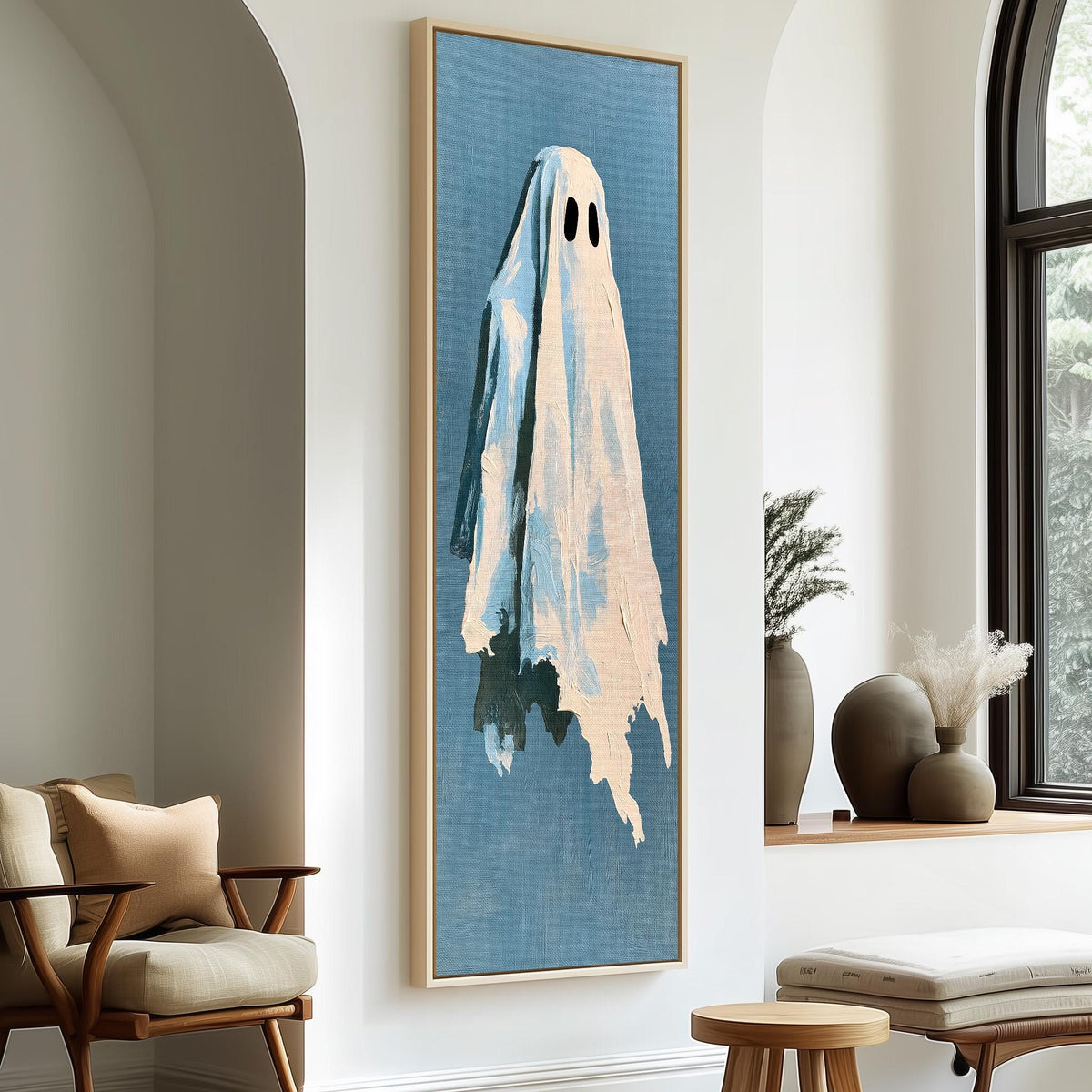 Folk art ghost on blue tall skinny canvas print in a sunlit living space