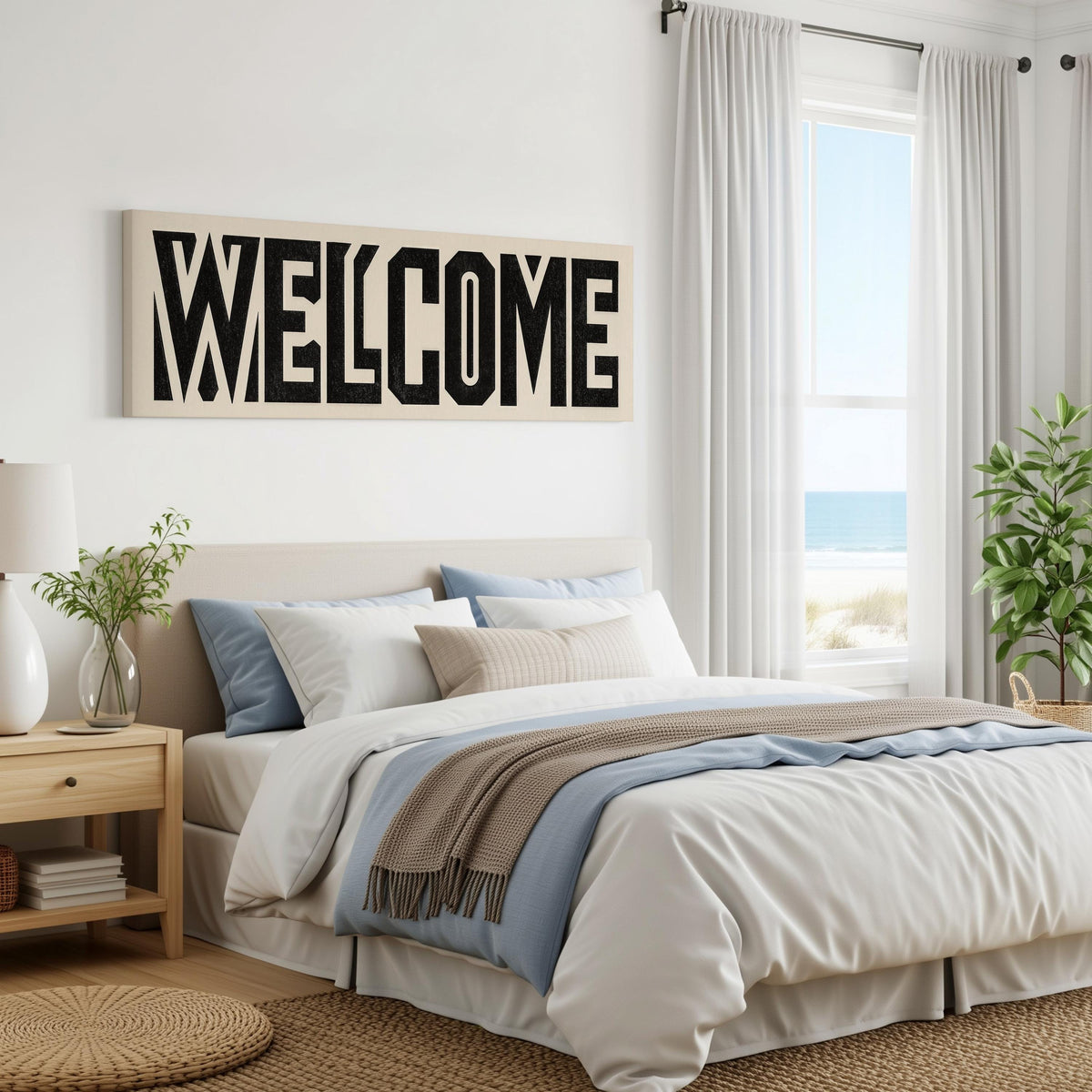 Bold welcome block letters panoramic canvas print above a bed in a coastal bedroom