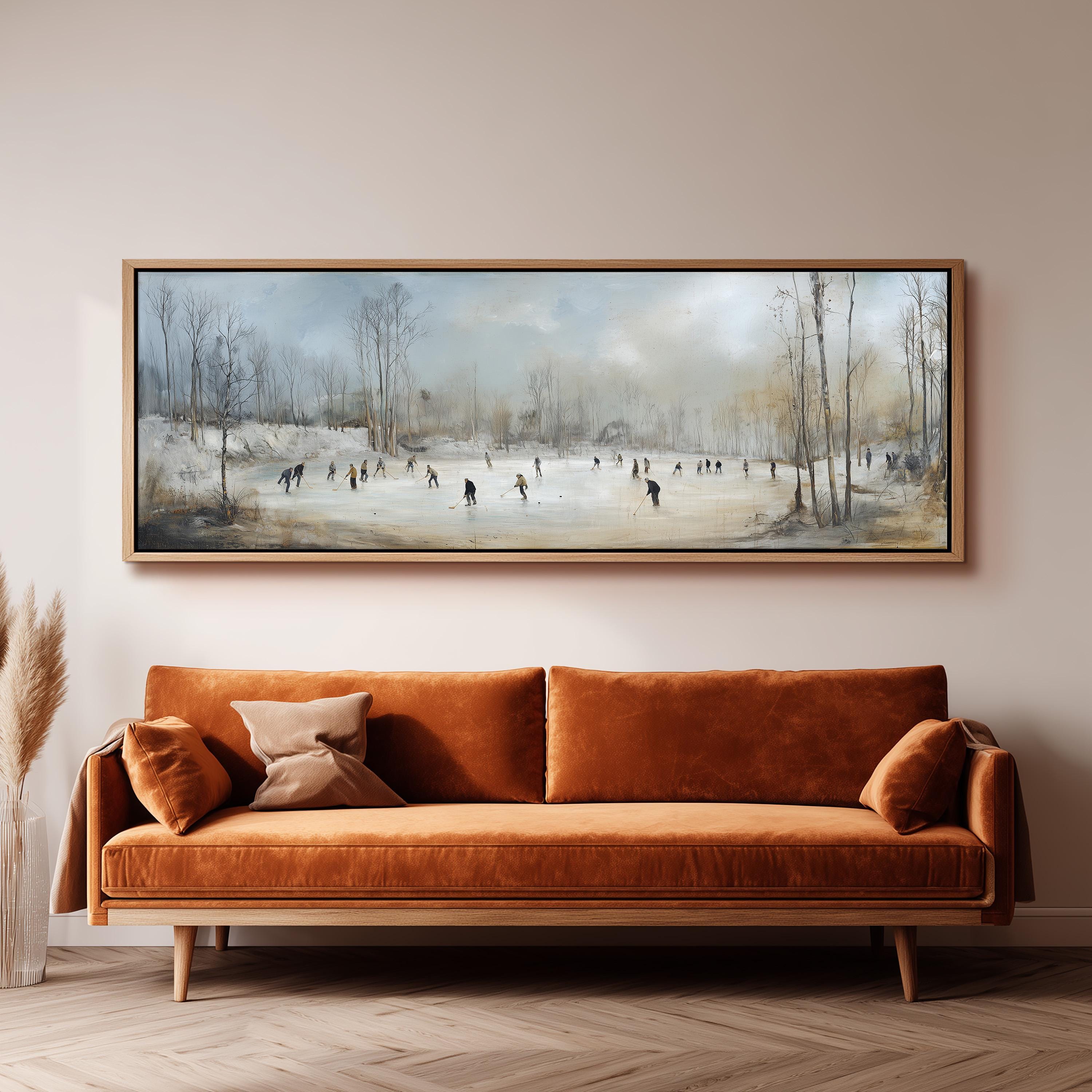 a large painting of people ice skating on a frozen lake, hanging on a wall above a brown sofa.
