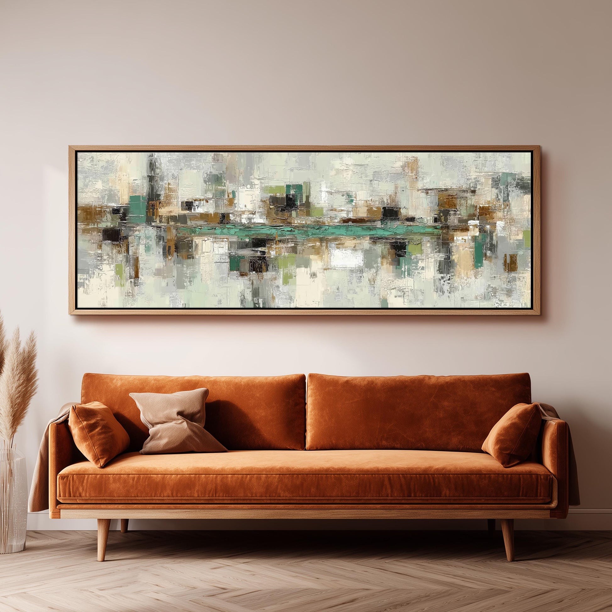 a large abstract painting hanging on a wall above a brown sofa with orange cushions.