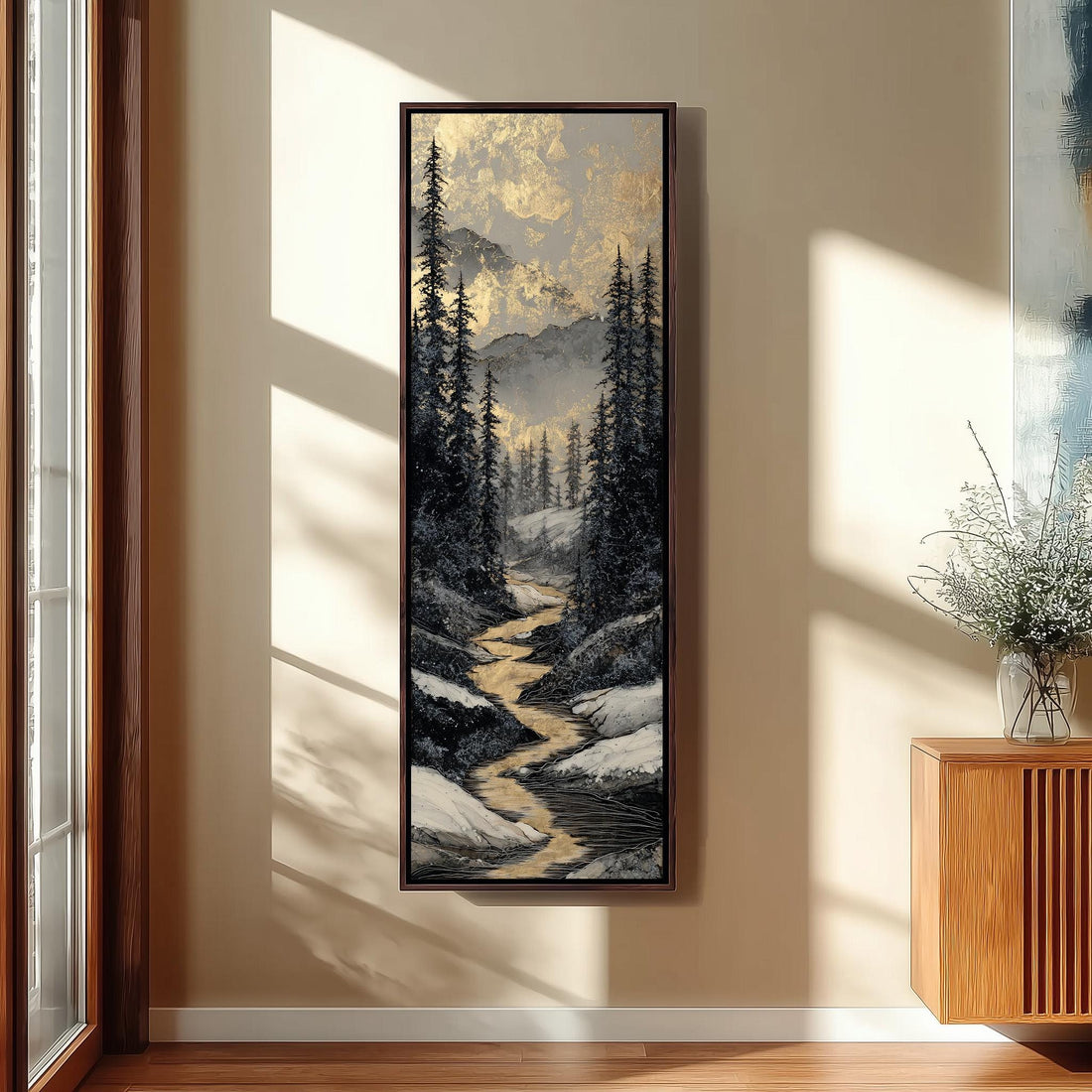 a serene bedroom scene with a large painting of a snowy mountain landscape hanging on the wall. The painting is framed in gold and depicts a winding path through a forest of pine trees. The room is decorated with a large window, a white vase with potted plants, and a wooden bench. The overall atmosphere of the room is calm and peaceful, with the painting serving as a focal point.