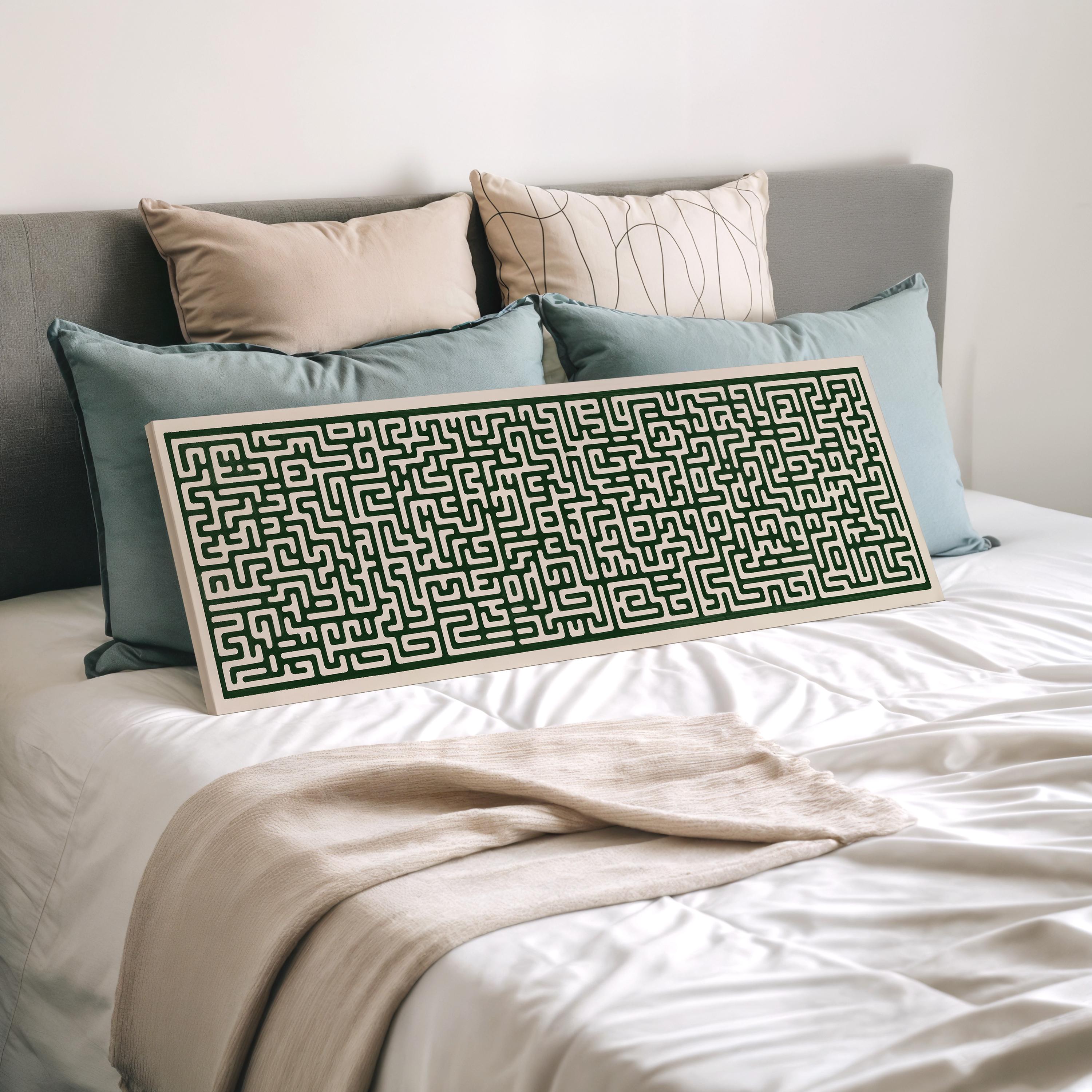 a bed with a large, intricate maze-like pattern on a white comforter, surrounded by various pillows.
