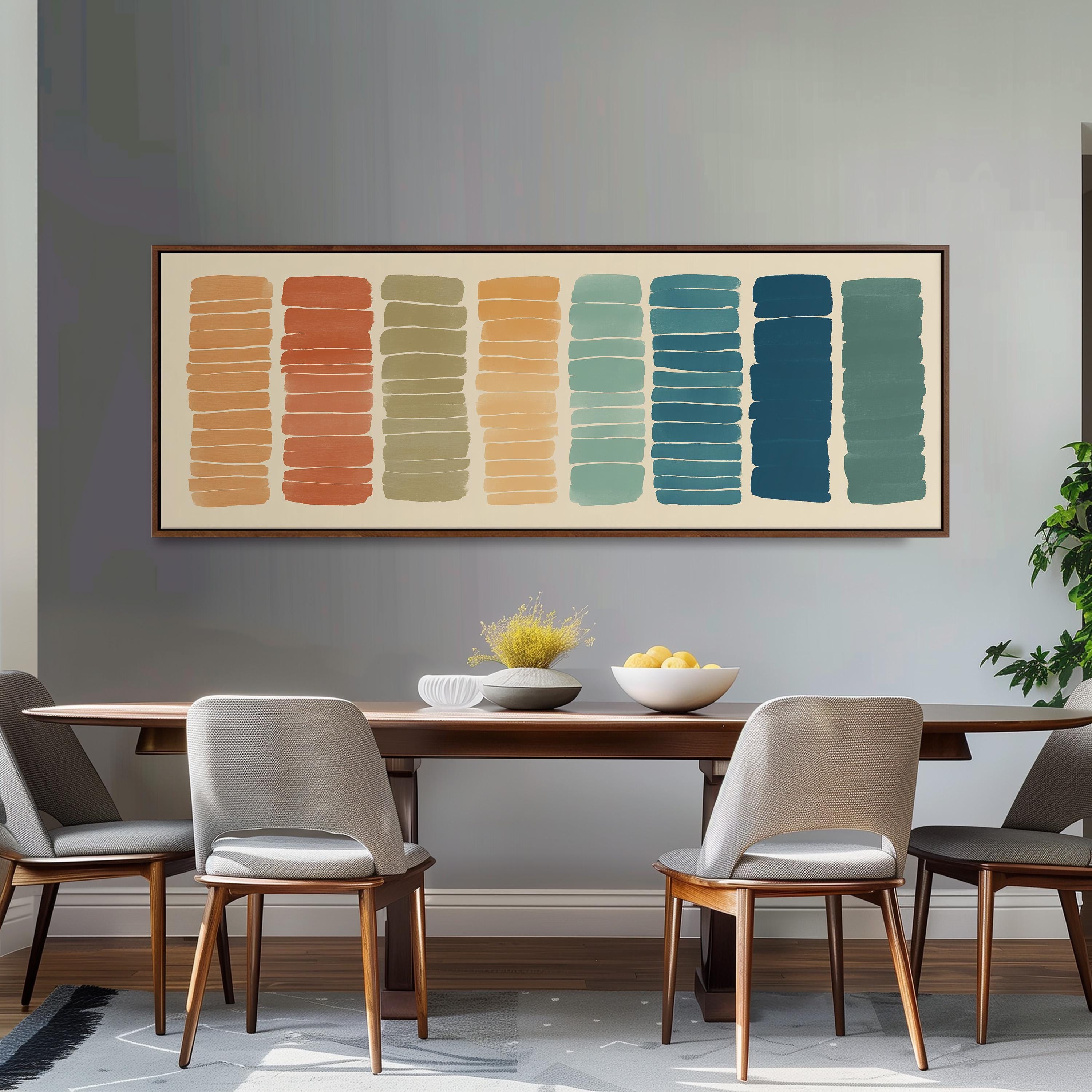 a dining room with a wooden table and four chairs. Above the table, there is a large abstract painting with vertical stripes in various colors, including orange, green, blue, and yellow. The painting is framed and hangs on the wall above the table.