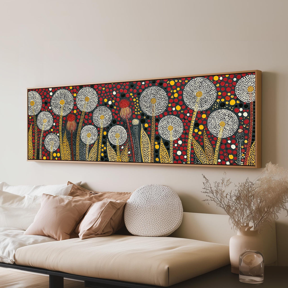 Dotted dandelions on deep red long horizontal canvas print above a sofa in a living room