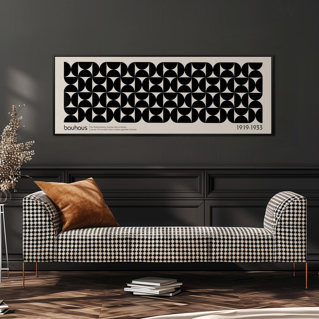a modern black and white checkered sofa with a brown throw pillow, set against a dark wall with a framed abstract art piece above it.