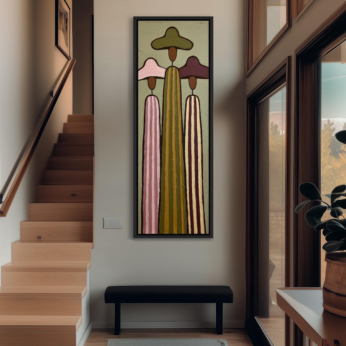Three tall striped figures in wide hats tall narrow canvas print beside a staircase in an entryway