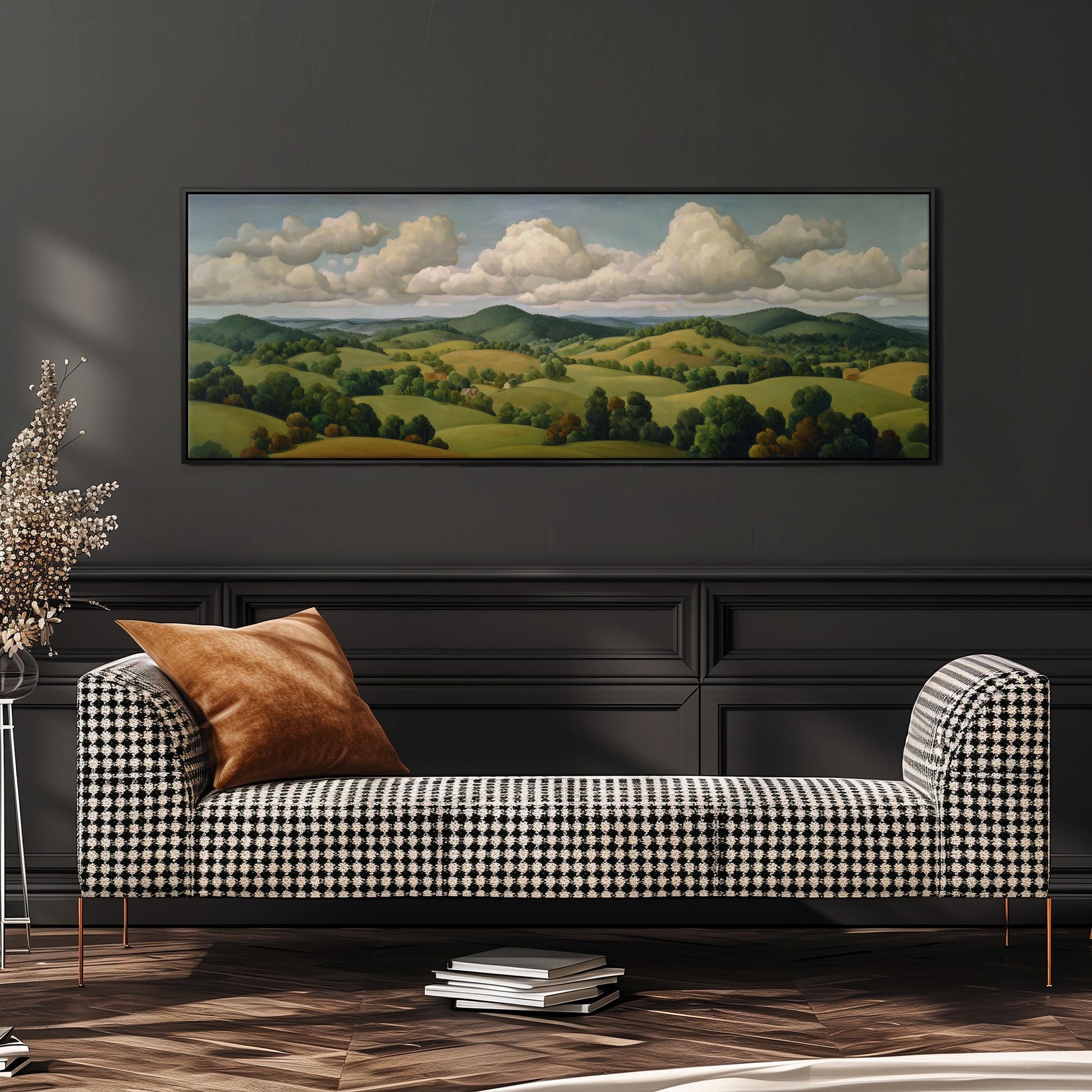 a large landscape painting hanging on a wall above a black and white checkered sofa in a living room setting.