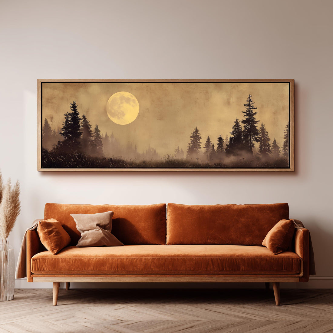 a large, framed painting of a forest scene with a full moon in the background.