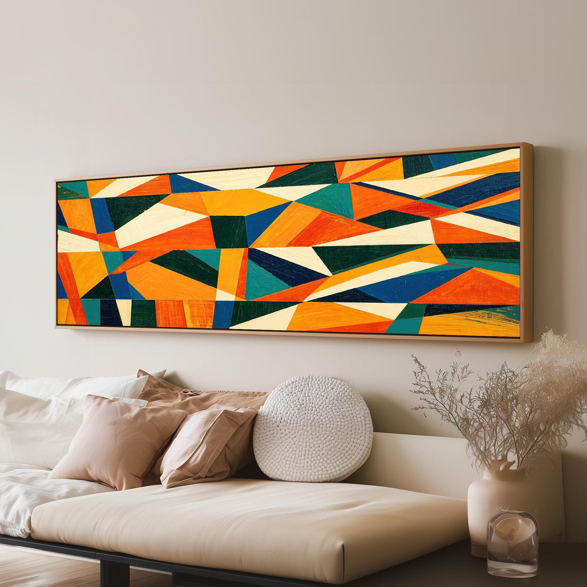 Orange and teal triangle mosaic panoramic canvas print above a sofa in a living room