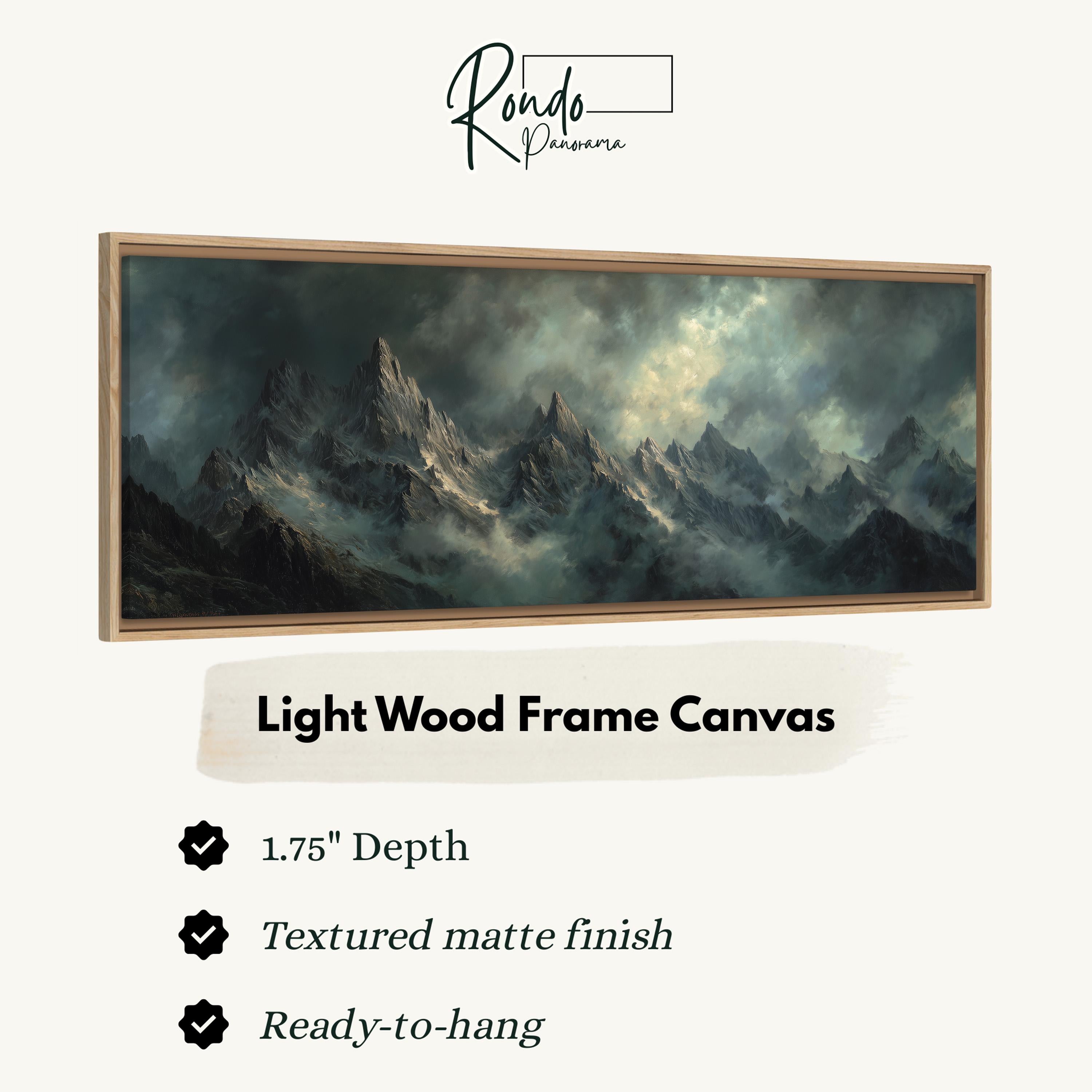 The image is a painting of a mountain landscape, displayed in a light wood frame.
