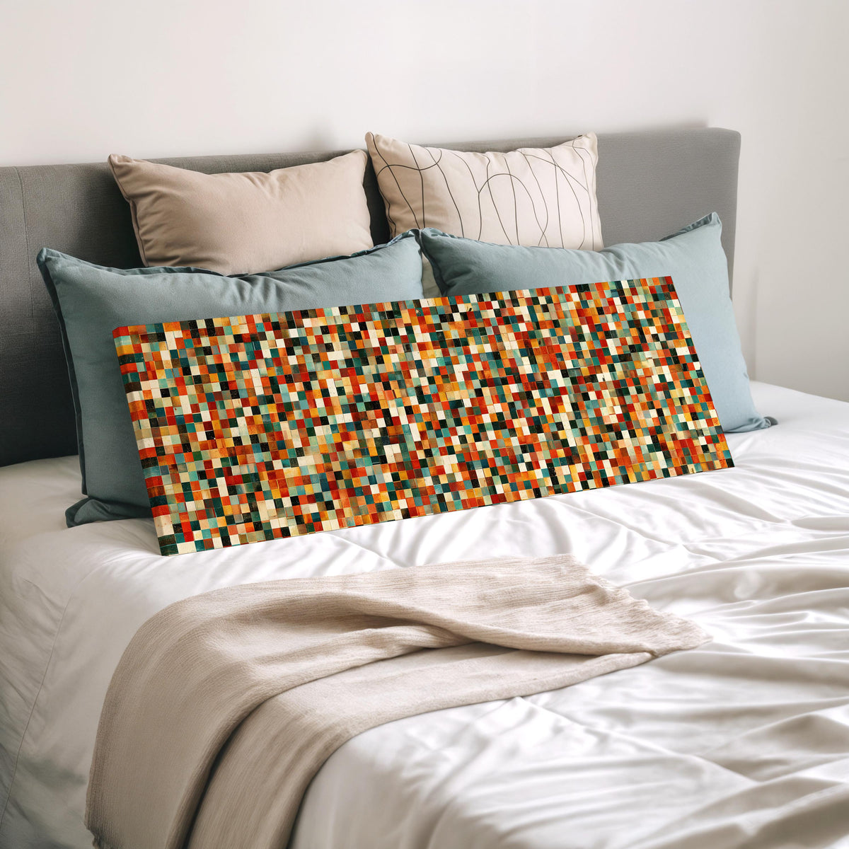 Dense autumn mosaic tiles wide panoramic canvas print laid on a bed to show its size