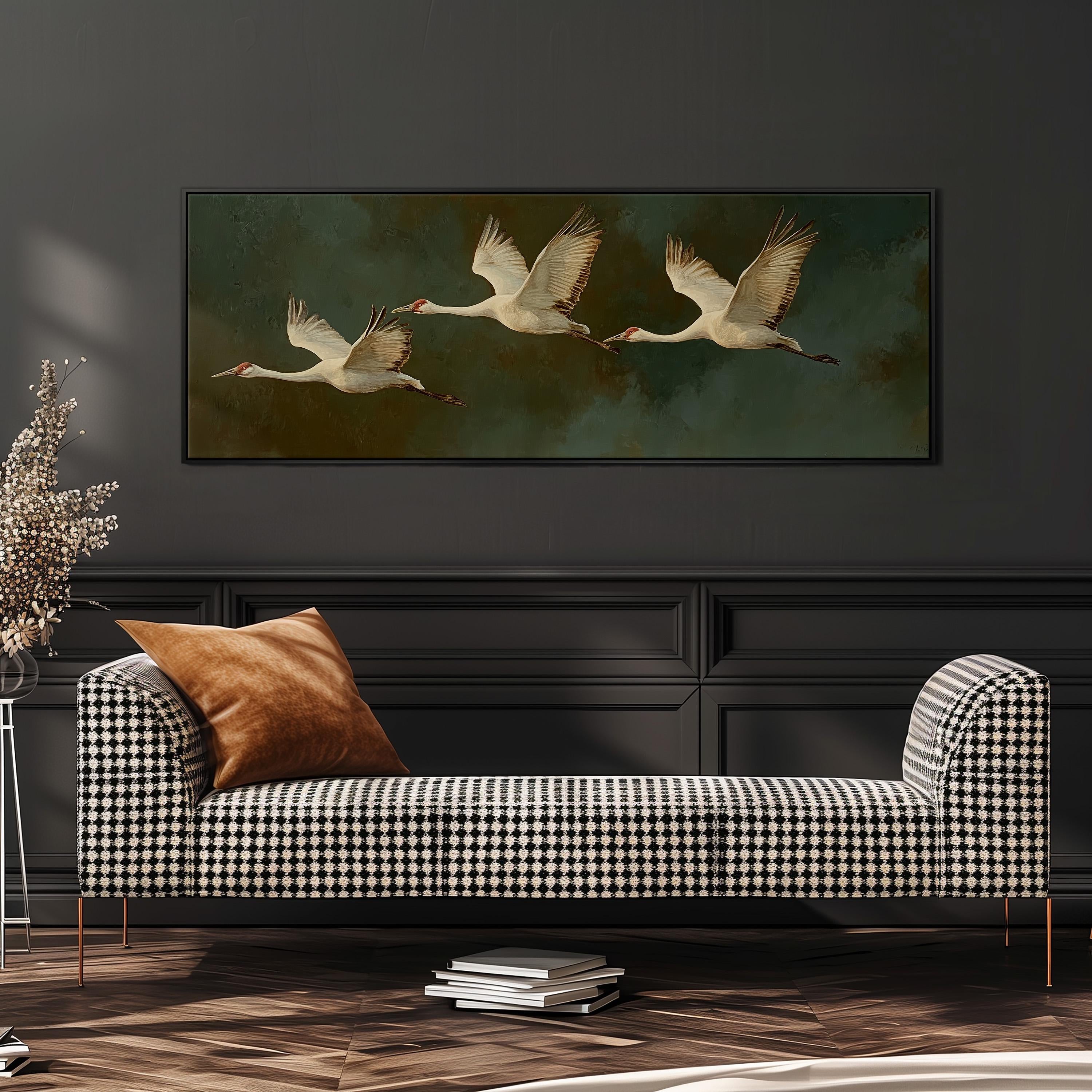 a black and white checkered sofa with a brown throw pillow, set against a dark wall with a framed painting of three swans in flight above it.