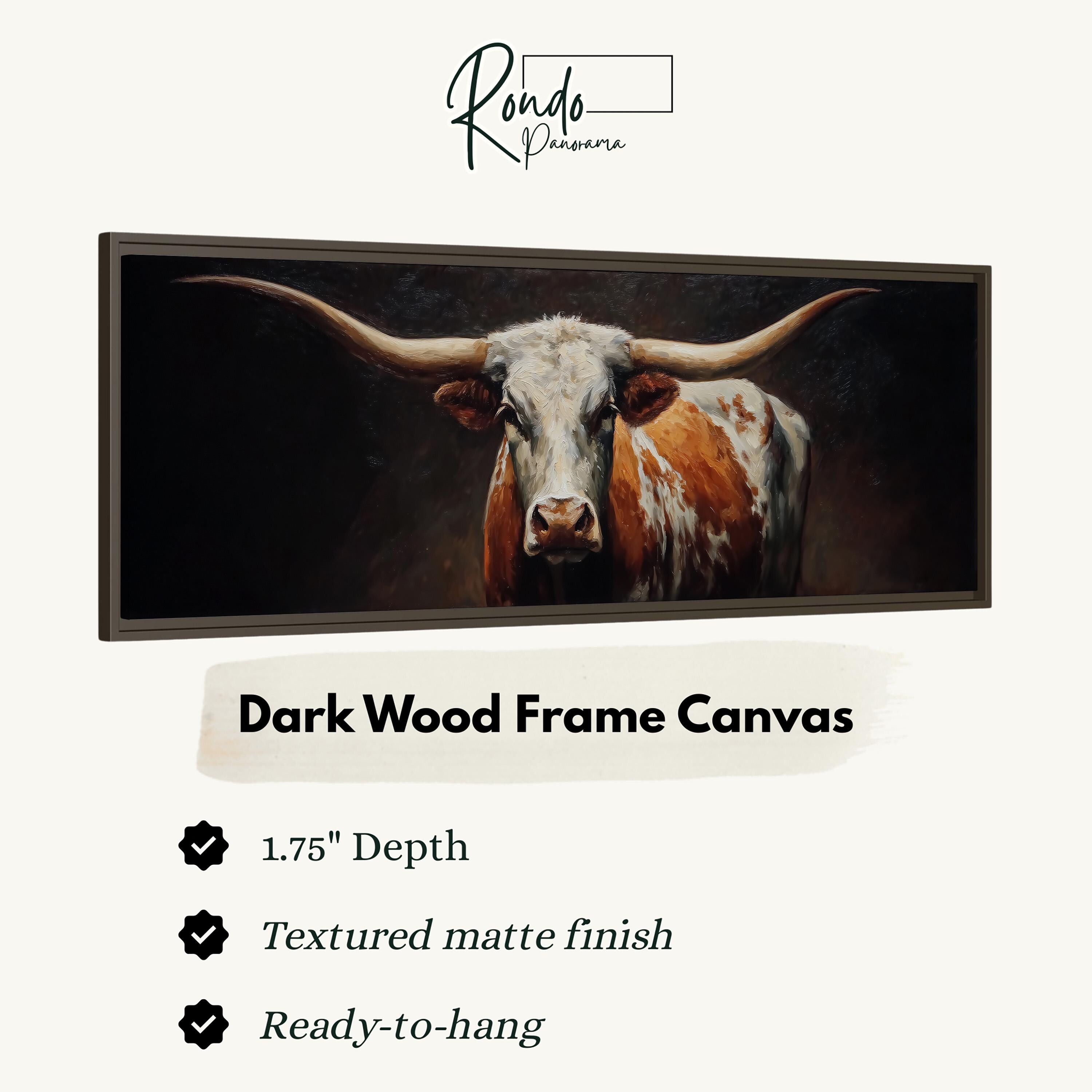 a close-up of a bull with long horns, displayed in a dark wood frame canvas.