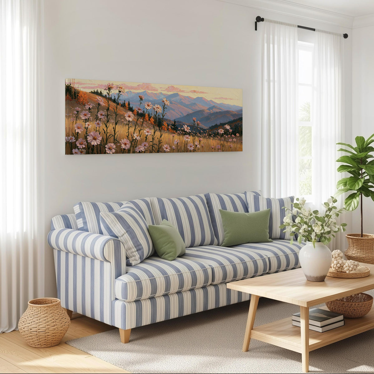 Wildflower meadow with mountains long horizontal canvas print above a striped sofa in a coastal living room